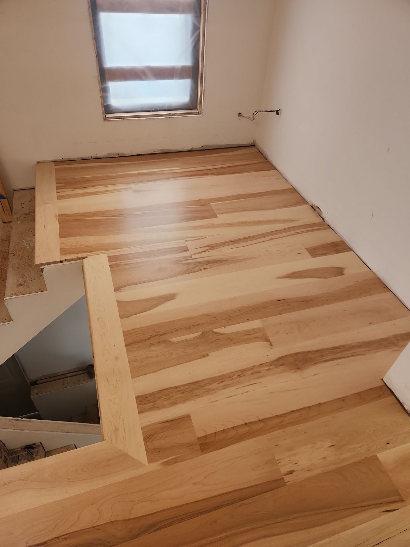 Full glue down Installation over radiant heat 7" Maple character grade by Ann Arbor Hardwoods 