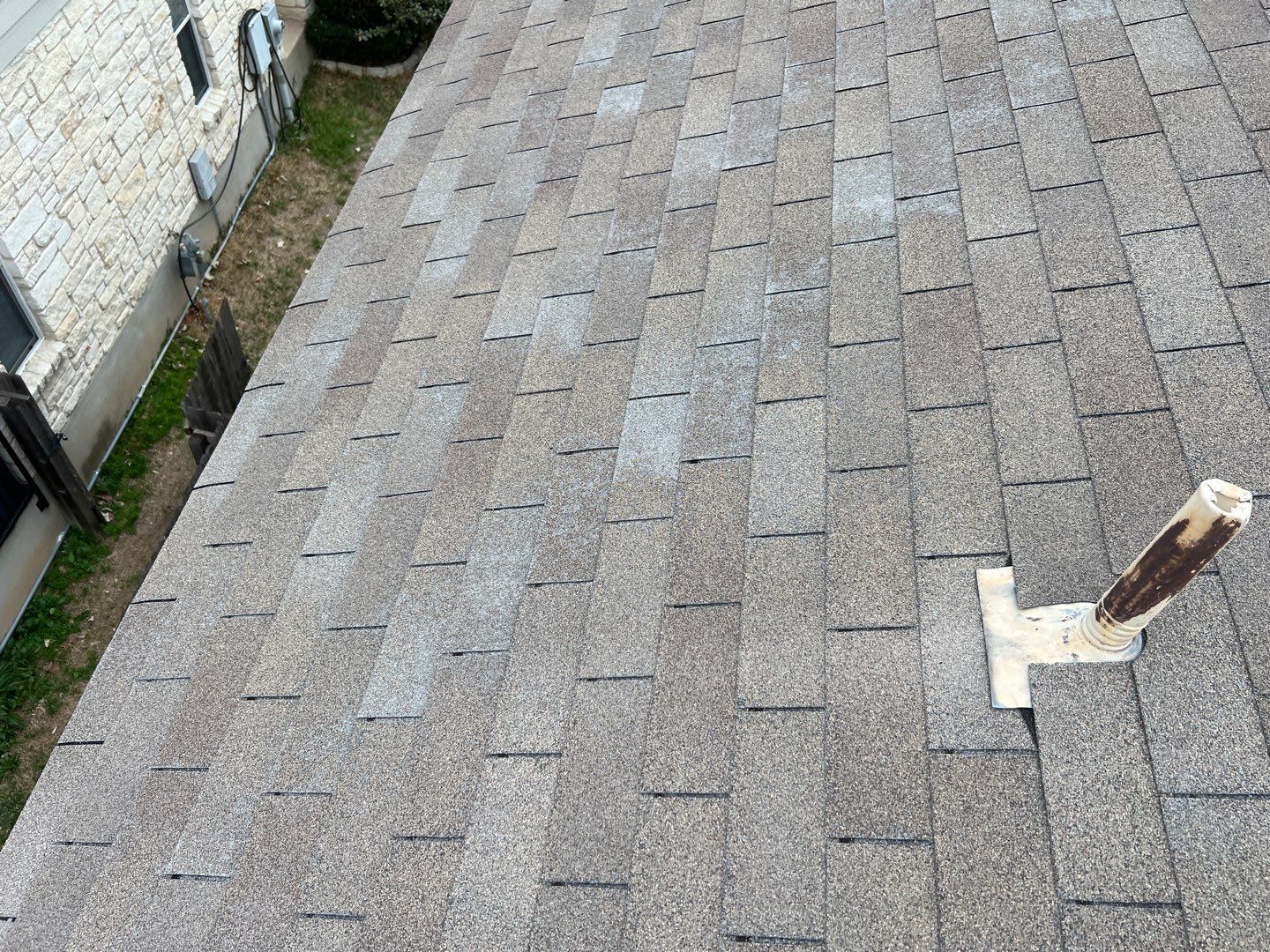 Wind damaged roof replacement by Oakwood Roofing and Construction, LLC