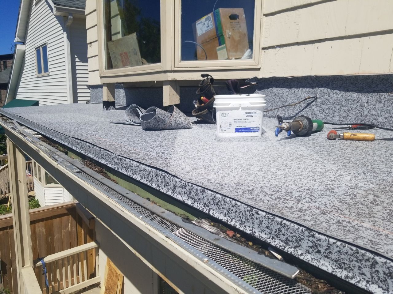 Residential Roofing Installation, Dec-tek walk-out porch roof, siding on garage by Absolute Roofing and Construction