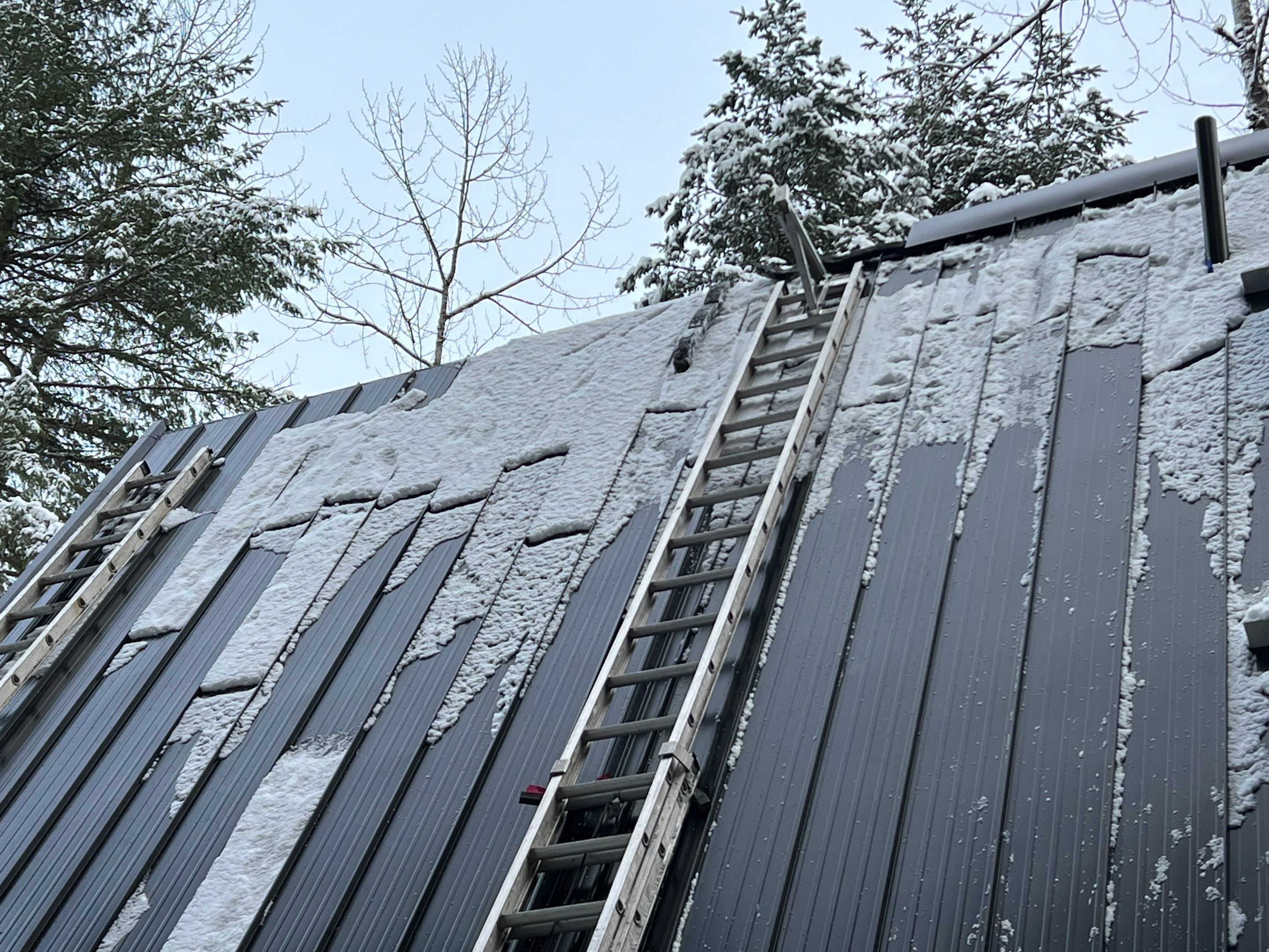 Residential Roofing Installation using 12" Prolok metal  by Top Notch Roofing Inc