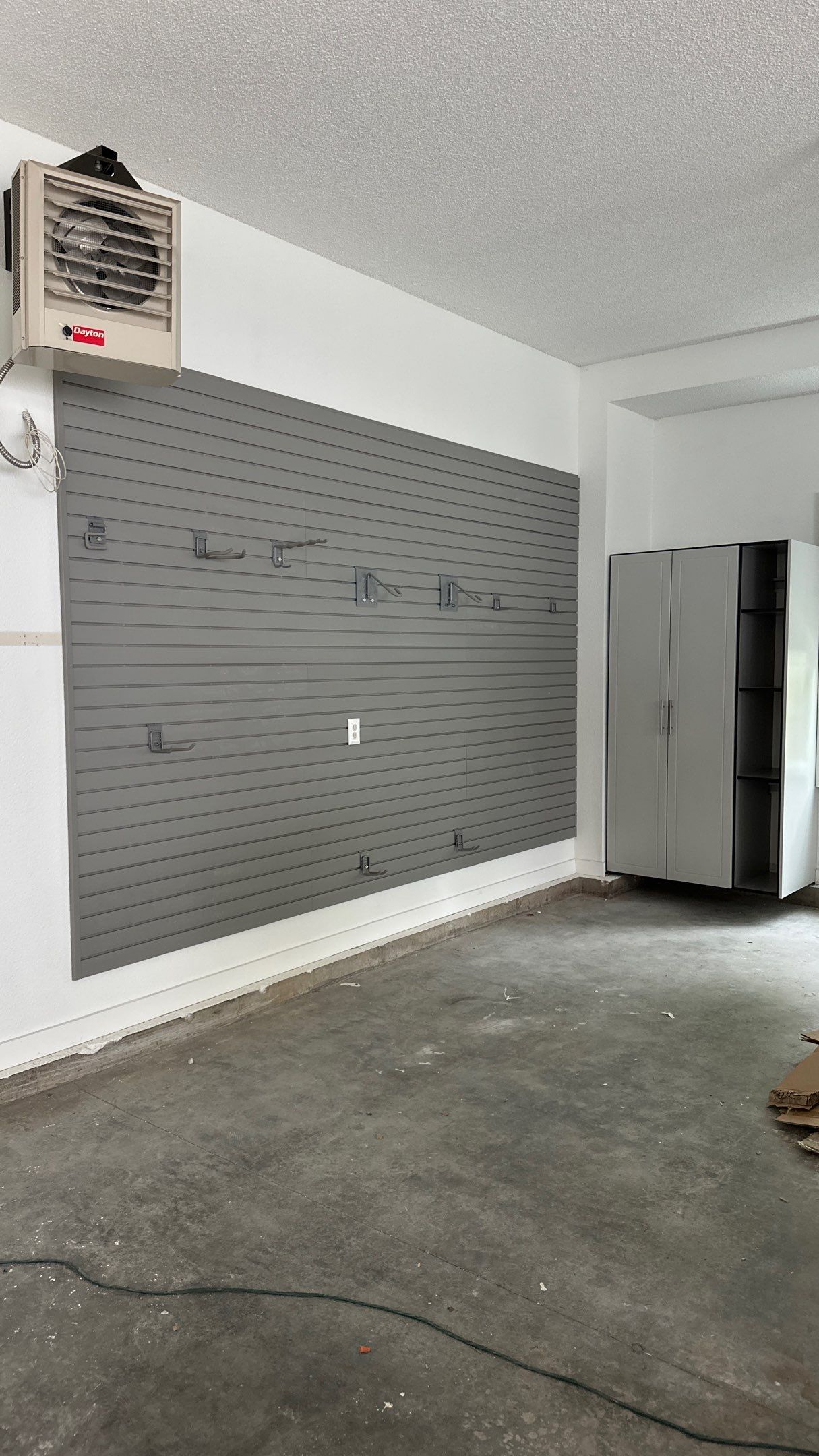 Brooke L. added cabinets for a clean storage look by Banner Garage