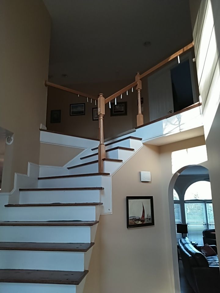 Stairway Installation using Red oak modern railings by House Custom Carpentry, LLC