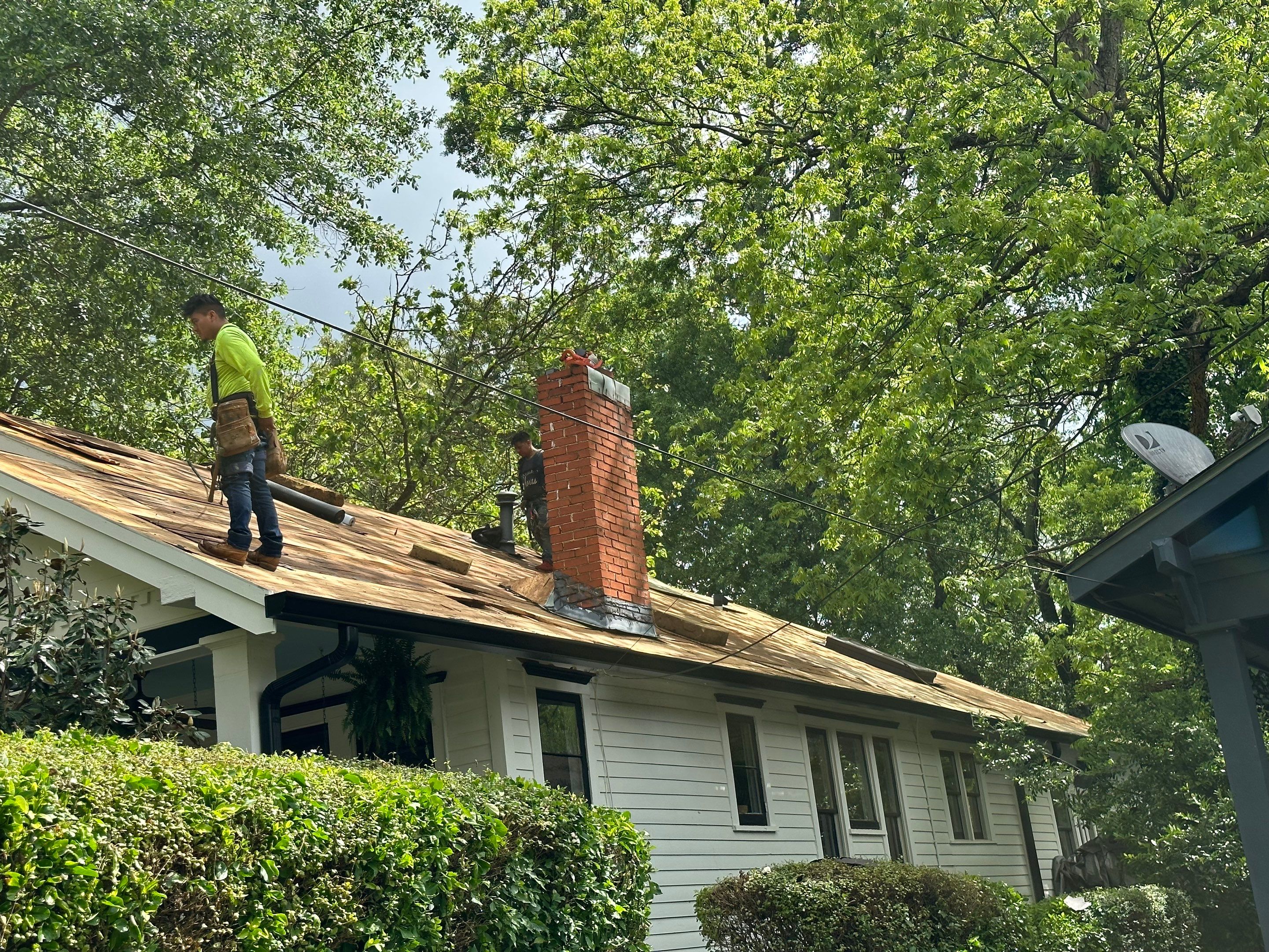 roof replacement and new black gutters by Nailed It Roofing & Remodeling LLC