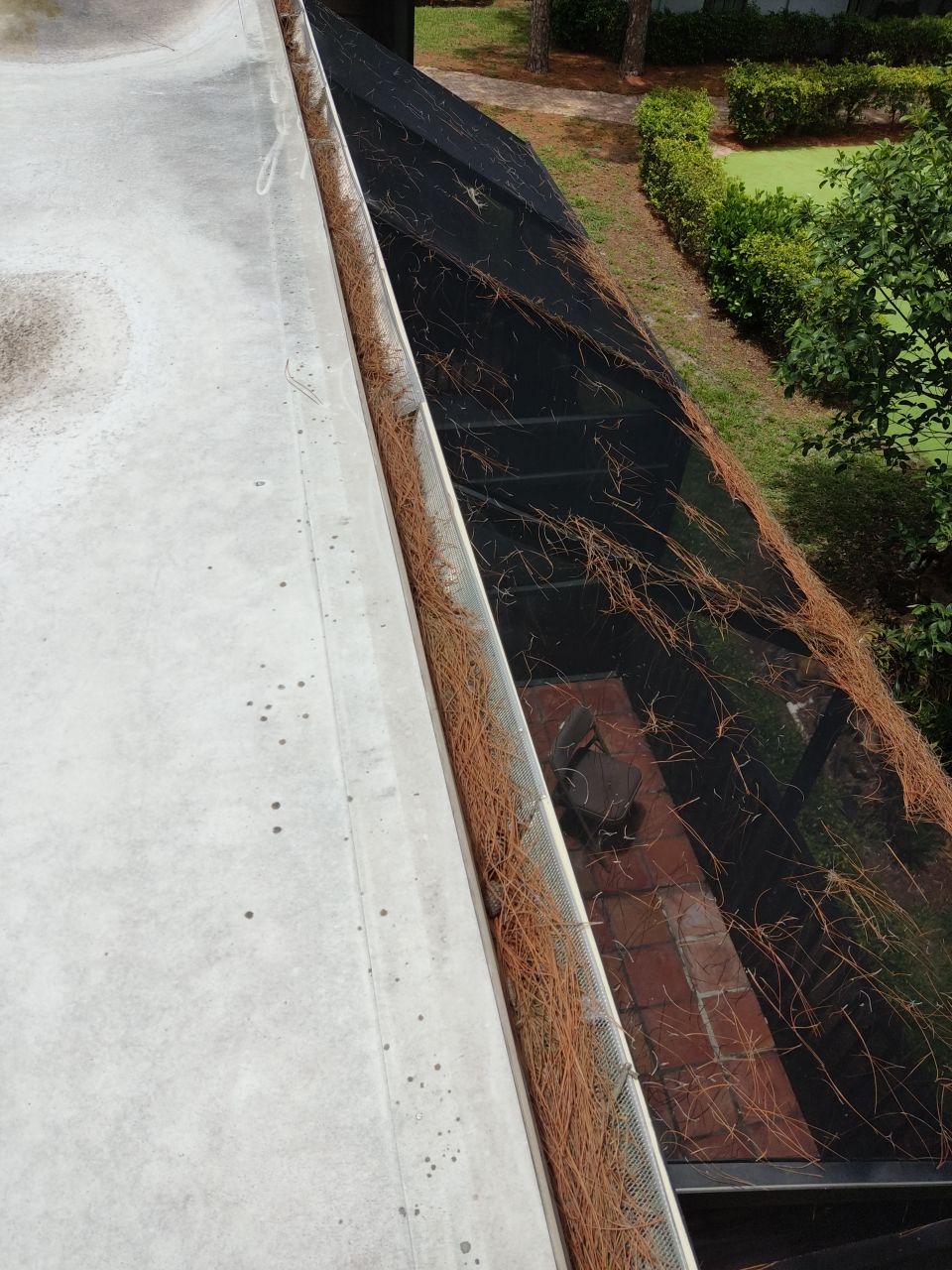 Commercial gutter cleaning West Palm Beach, FL	 before photo with filled gutters