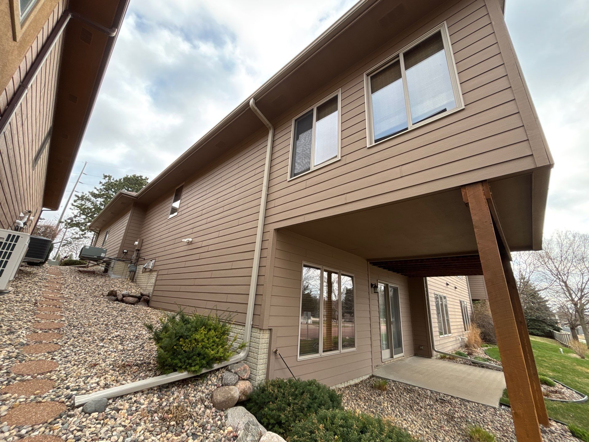 Multi-Story Residential Exterior Painting and Siding Refresh in Sioux Falls by Select Painting, Coatings & Garage Cabinets