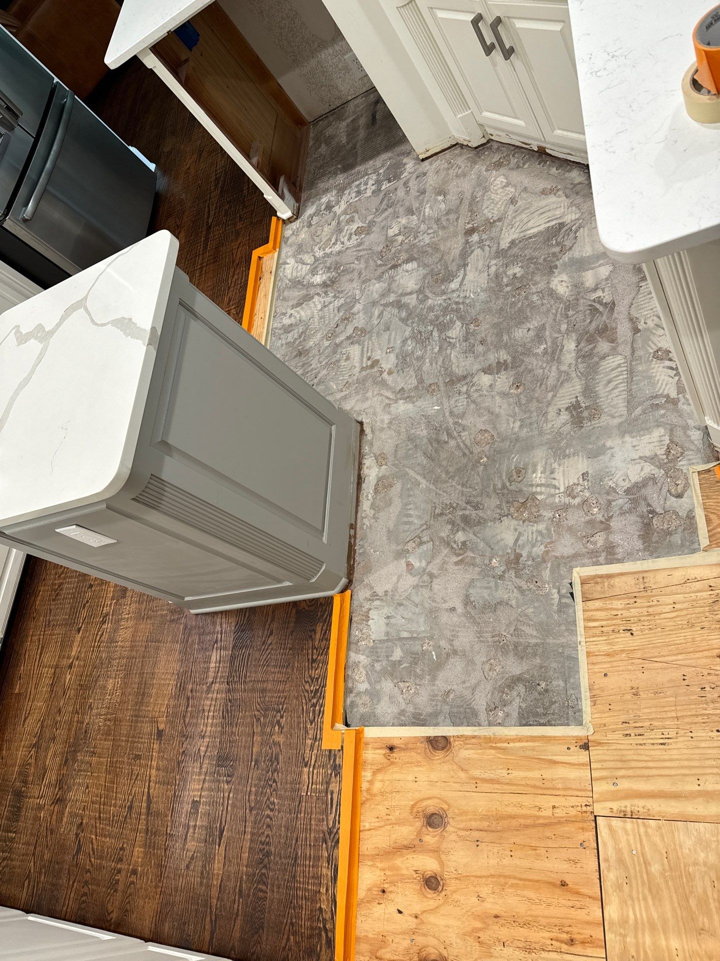 Dishwasher Flood Repair by Fine Line Flooring Inc.