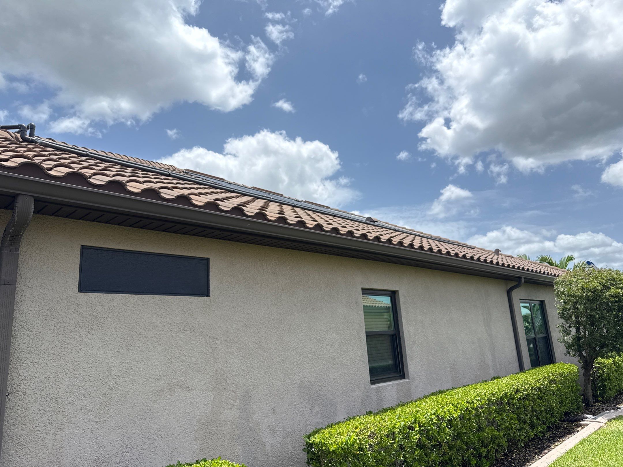 Neighboring Tile Roof Cleaning with Gutter Runoff Control – Palmetto, FL by Sunshine AquaWash