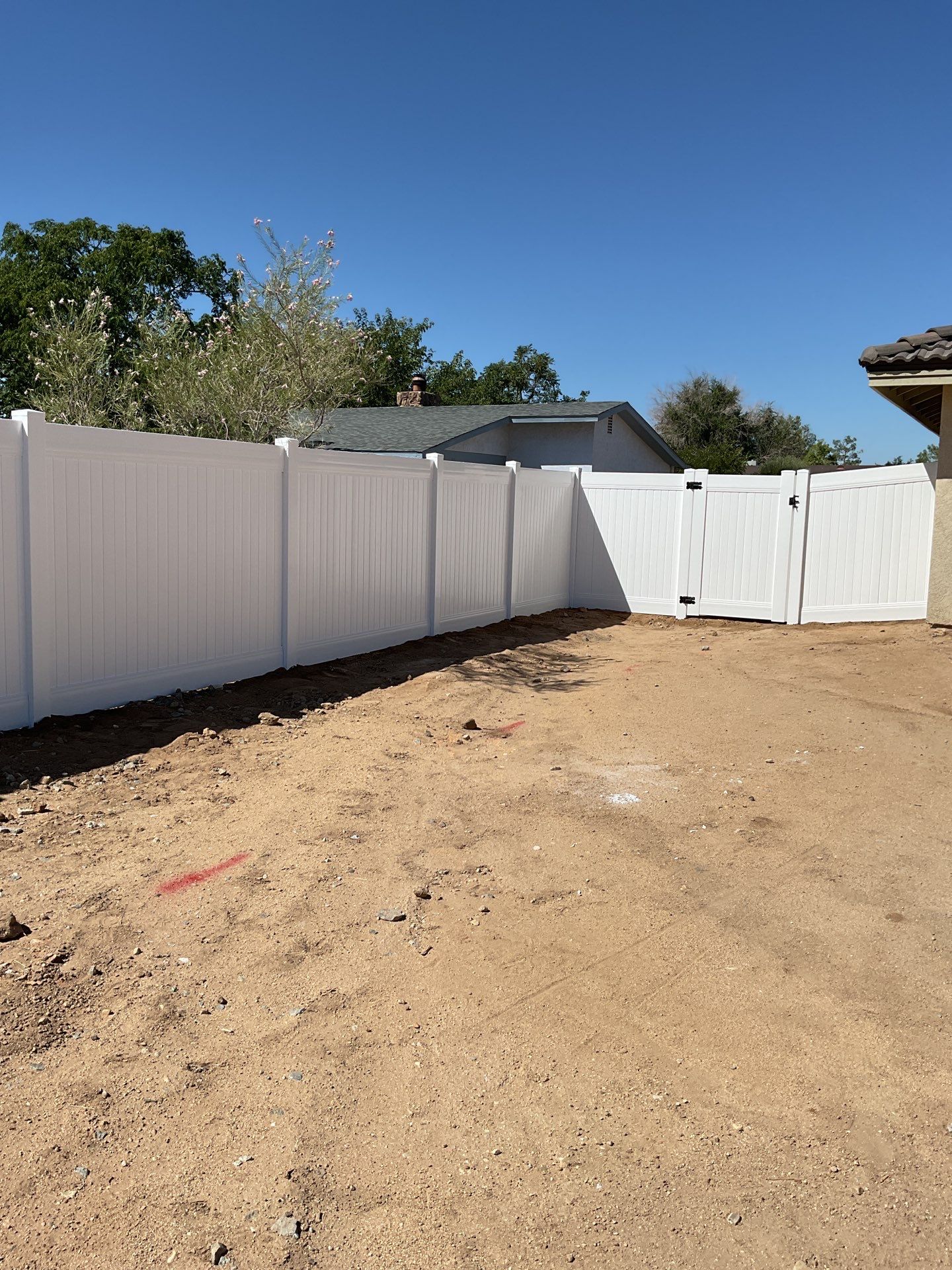 6ft White Privacy Vinyl Fence with Chain-link Fence by Fence Guys Inc.