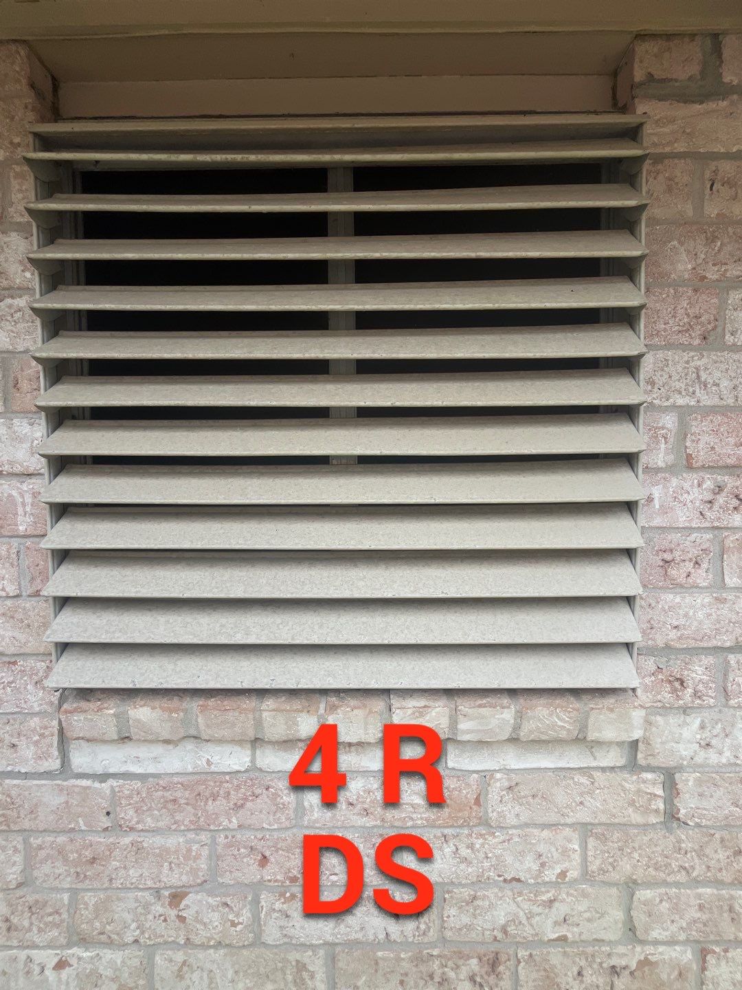 Colored Vinyl Windows to blend into brick by Bayfront Roofing and Construction