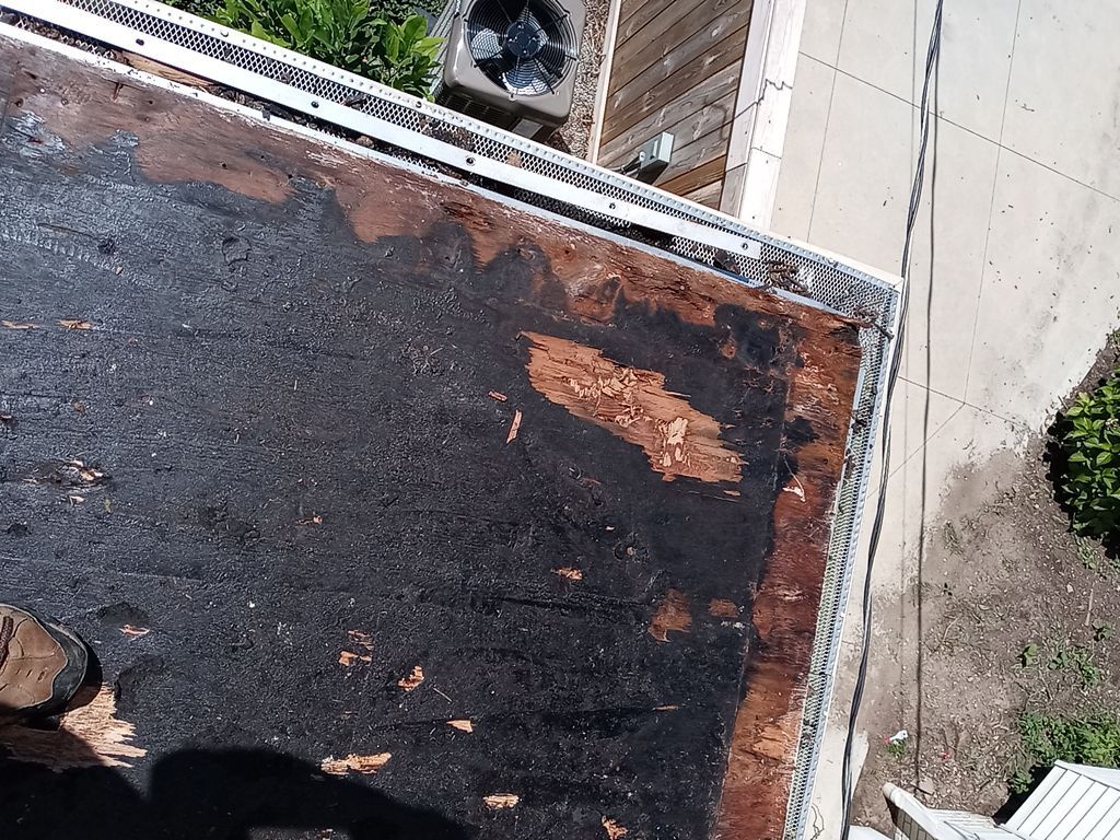 Residential Roofing Installation, Dec-tek walk-out porch roof, siding on garage by Absolute Roofing and Construction