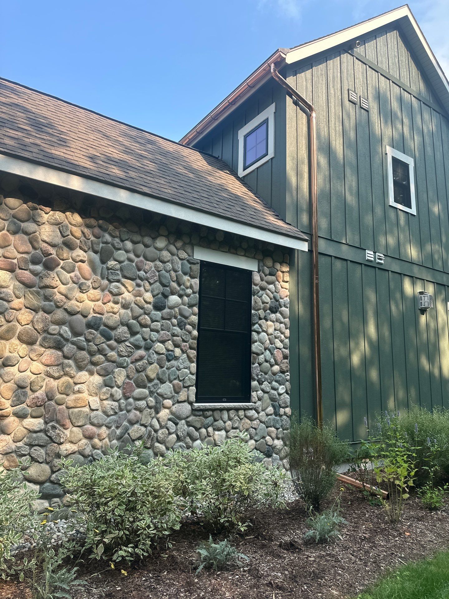 Copper Gutter and Downspout Installation for Omena Residence by Rainbow Seamless Systems