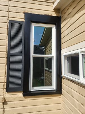 Vinyl Window Replacement and Black Shutter Installation in Dennison