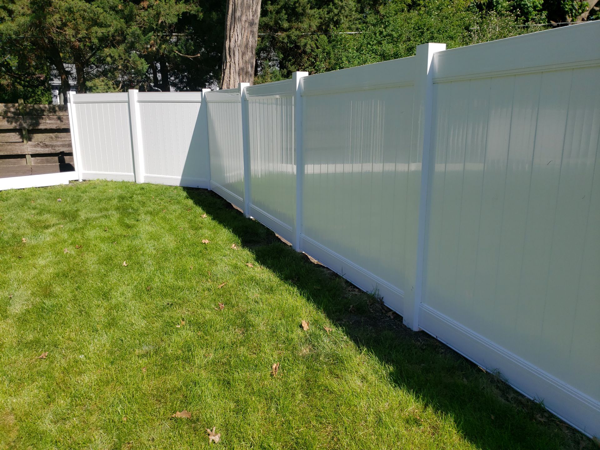 Residential White Vinyl Privacy Fence Installation in Waterloo by Perfect Picket Fence and Stain
