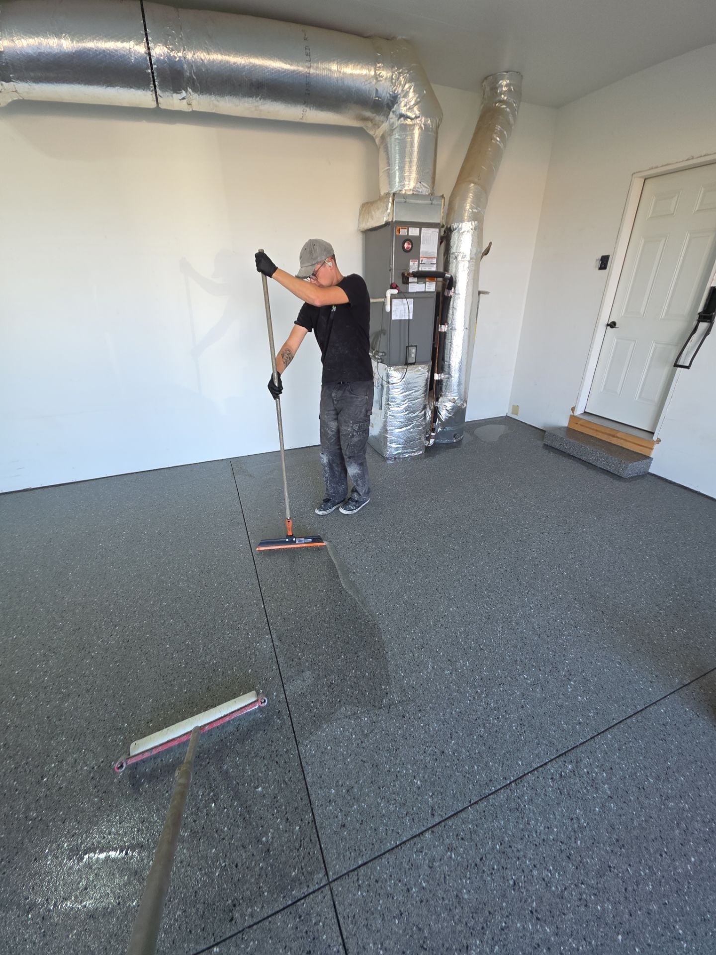 Polyaspartic Garage Floor Coating With Slate Hybrid Flake in Davenport by Croc Coatings, LLC
