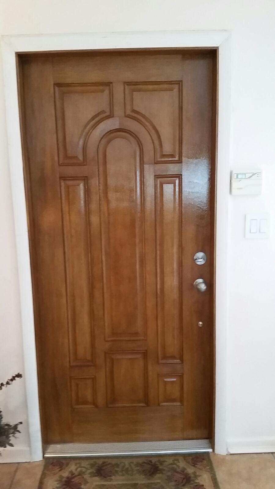 Faux Wood, Fiberglass Entry Door Replacement with Arched Panels in Fort Lauderdale by The Door Doctor of South Florida, Inc.