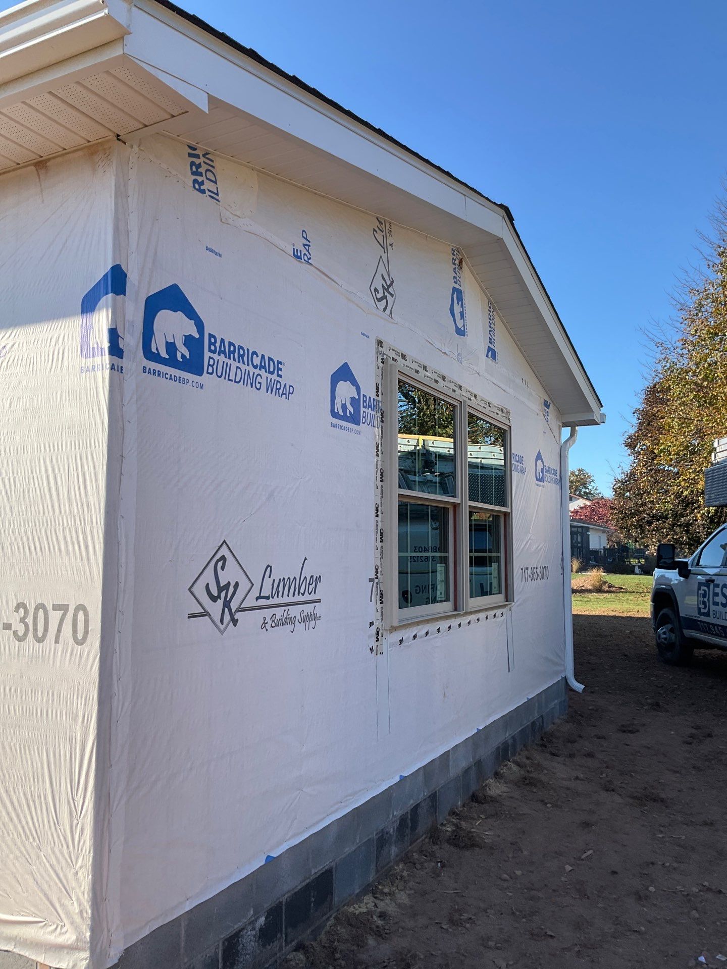 Residential Addition and Covered Porch Roof  by Esh Builders