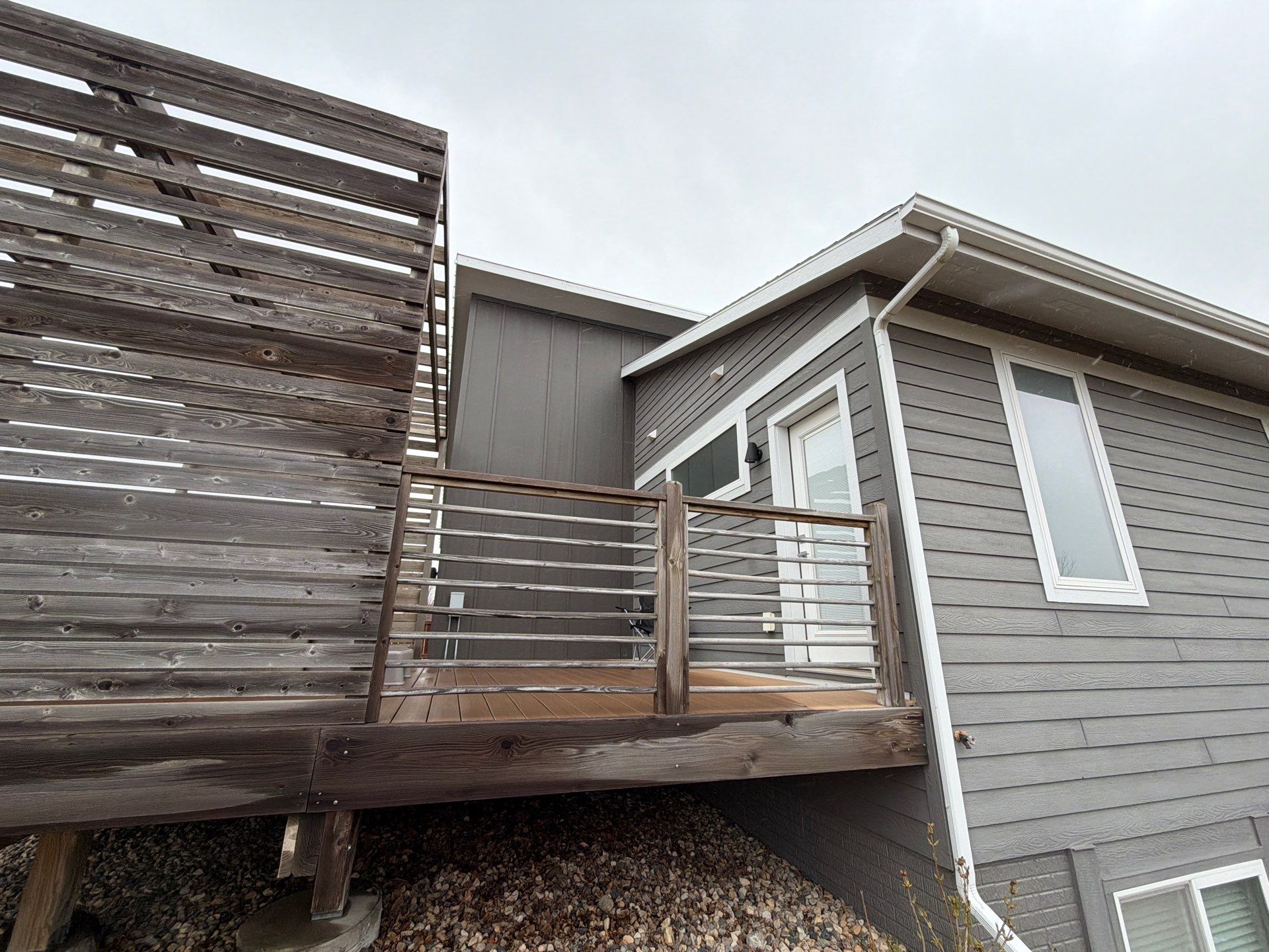 Modern Exterior Transformation Featuring Dark Board and Batten Siding in Sioux Falls by Select Painting, Coatings & Garage Cabinets