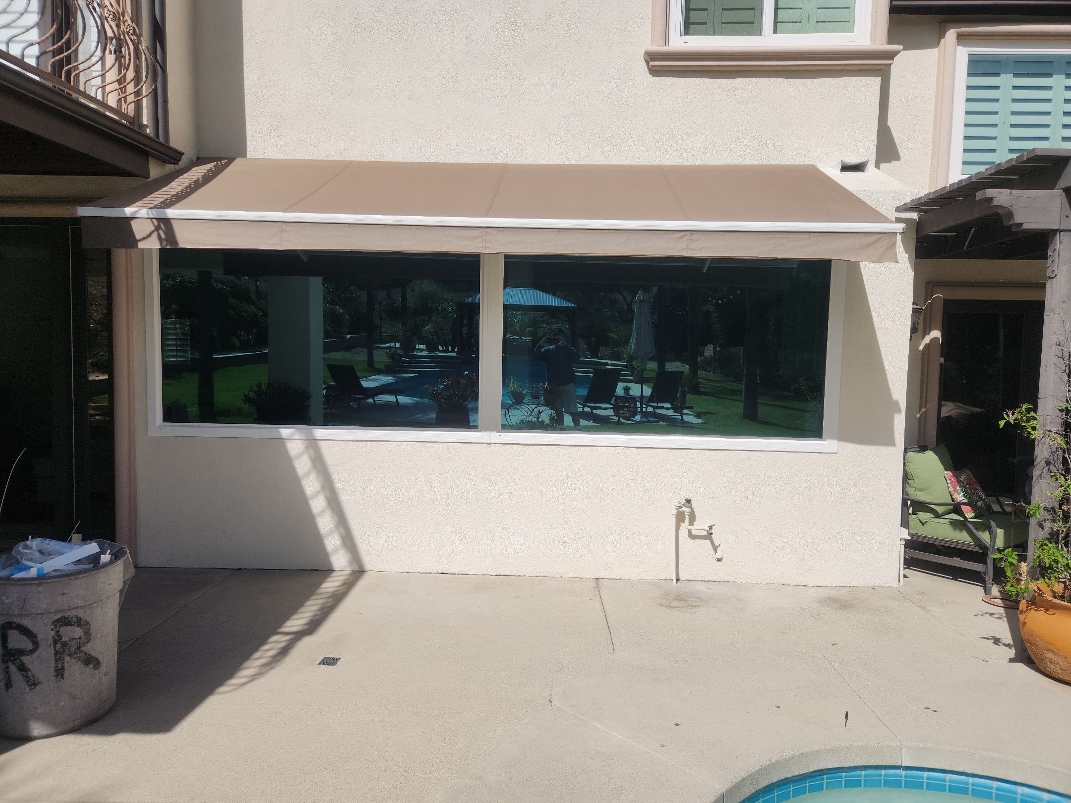 Window Installation using Anlin vinyl windows with Sunshield glass by American Window Company