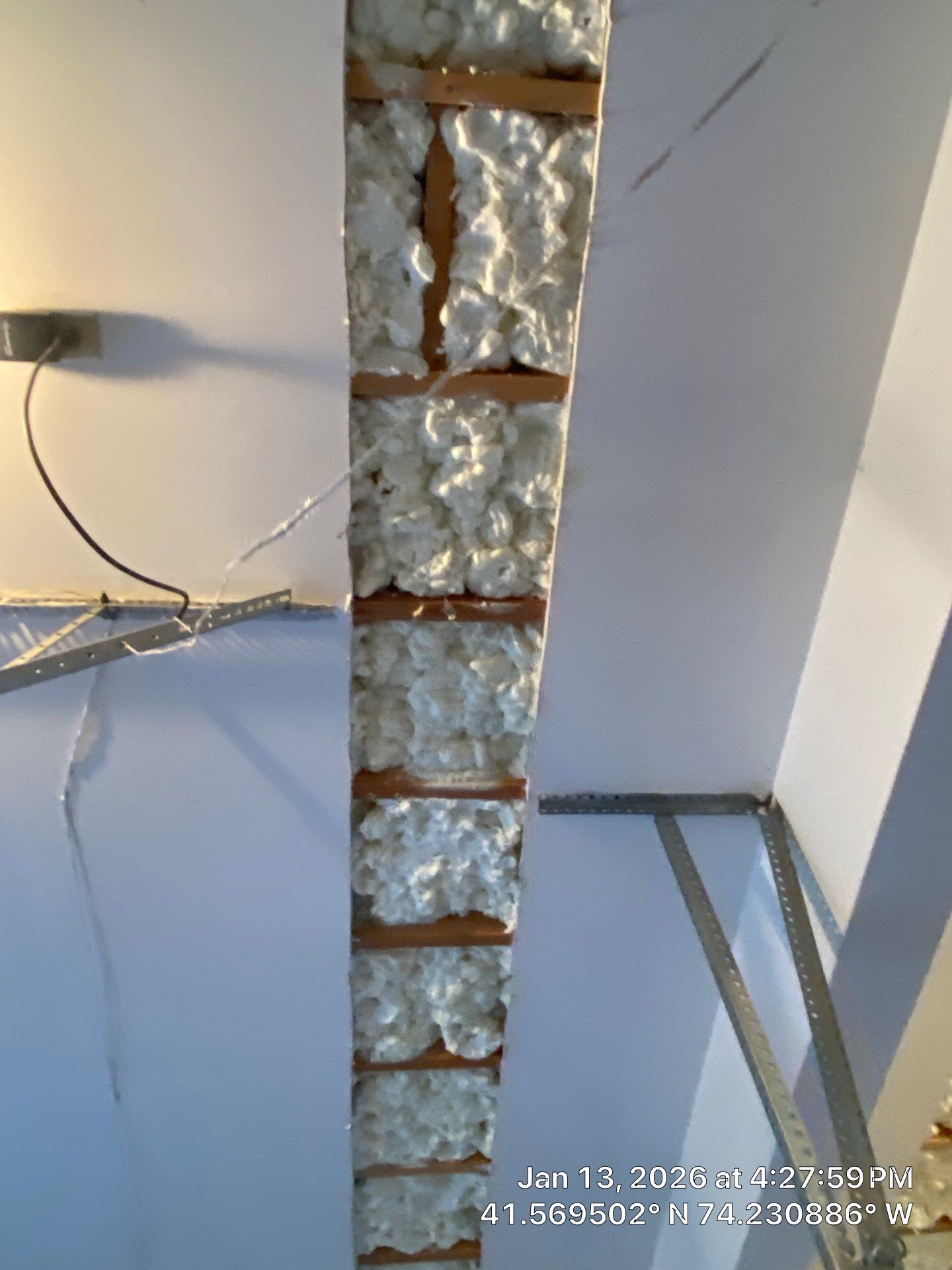 Garage ceiling using open cell spray foam by NYS Foam & Energy