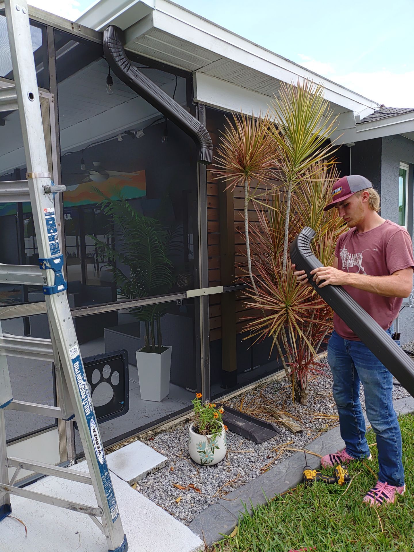 3x4 Downspouts Bronze Installation in Cape Coral FL by Gutter Professors
