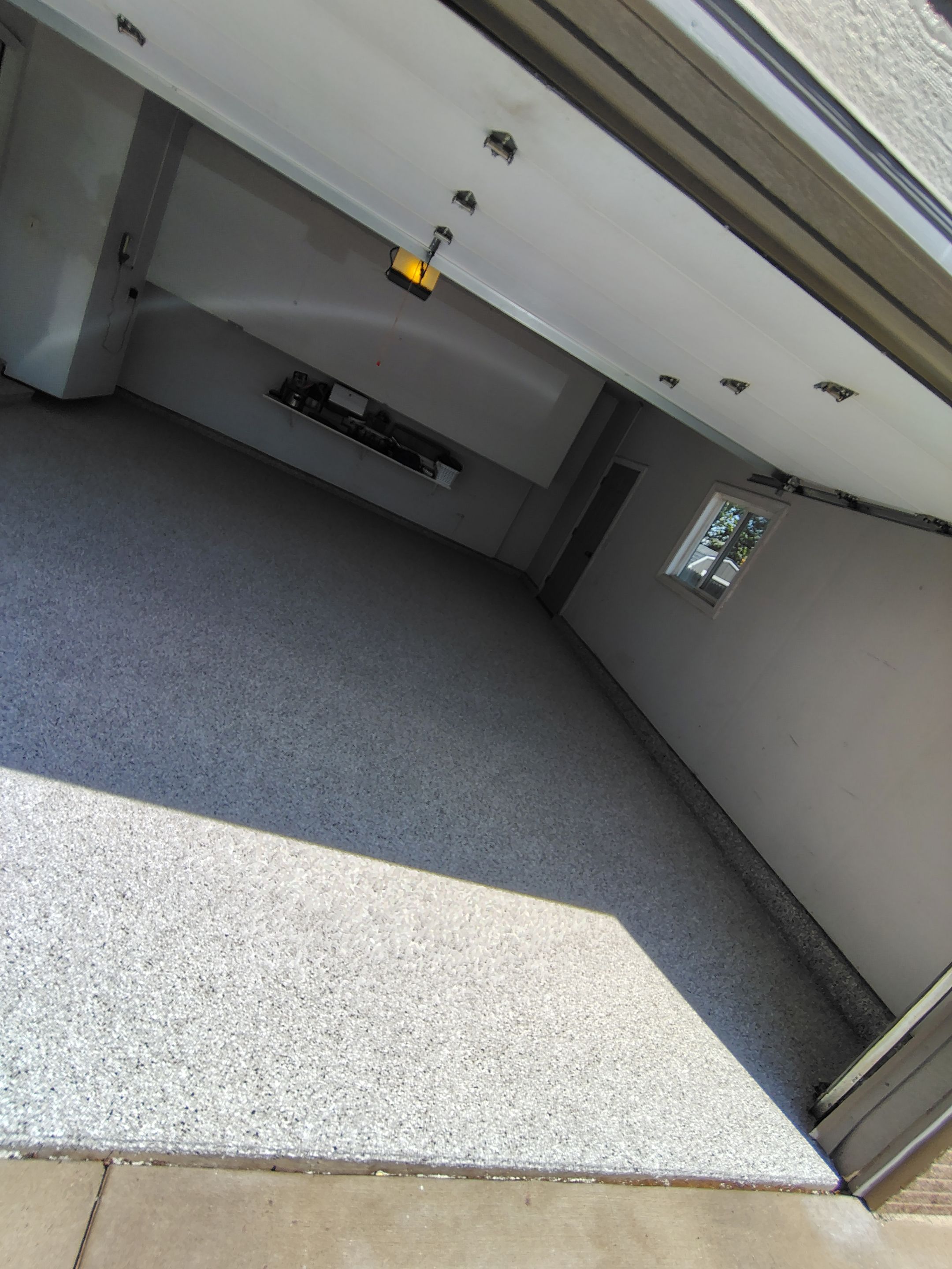 Decorative Chip Epoxy Garage Floor Coating in Sioux Falls by Select Painting, Coatings & Garage Cabinets