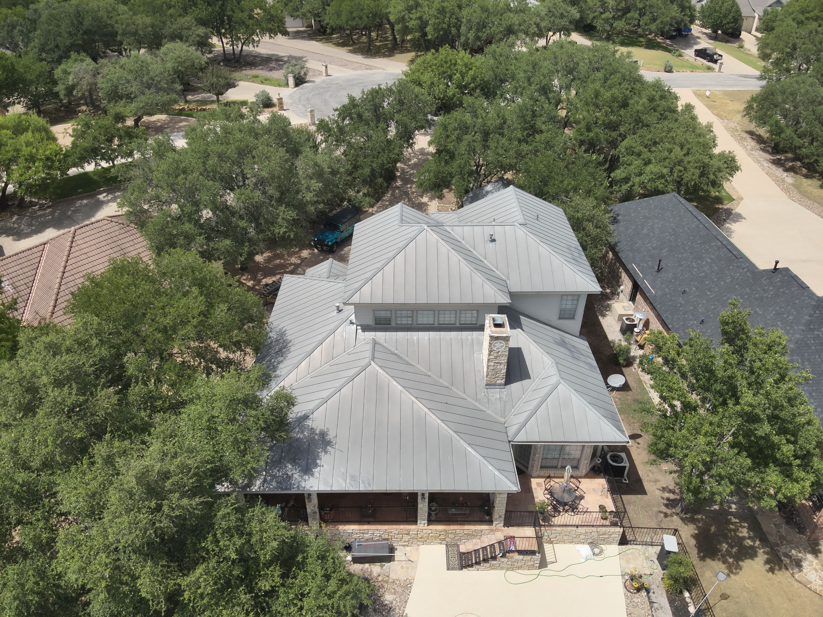Residential Roof Replacement using 24 GA Double-Lock - Surrey Beige by Action Exteriors Austin