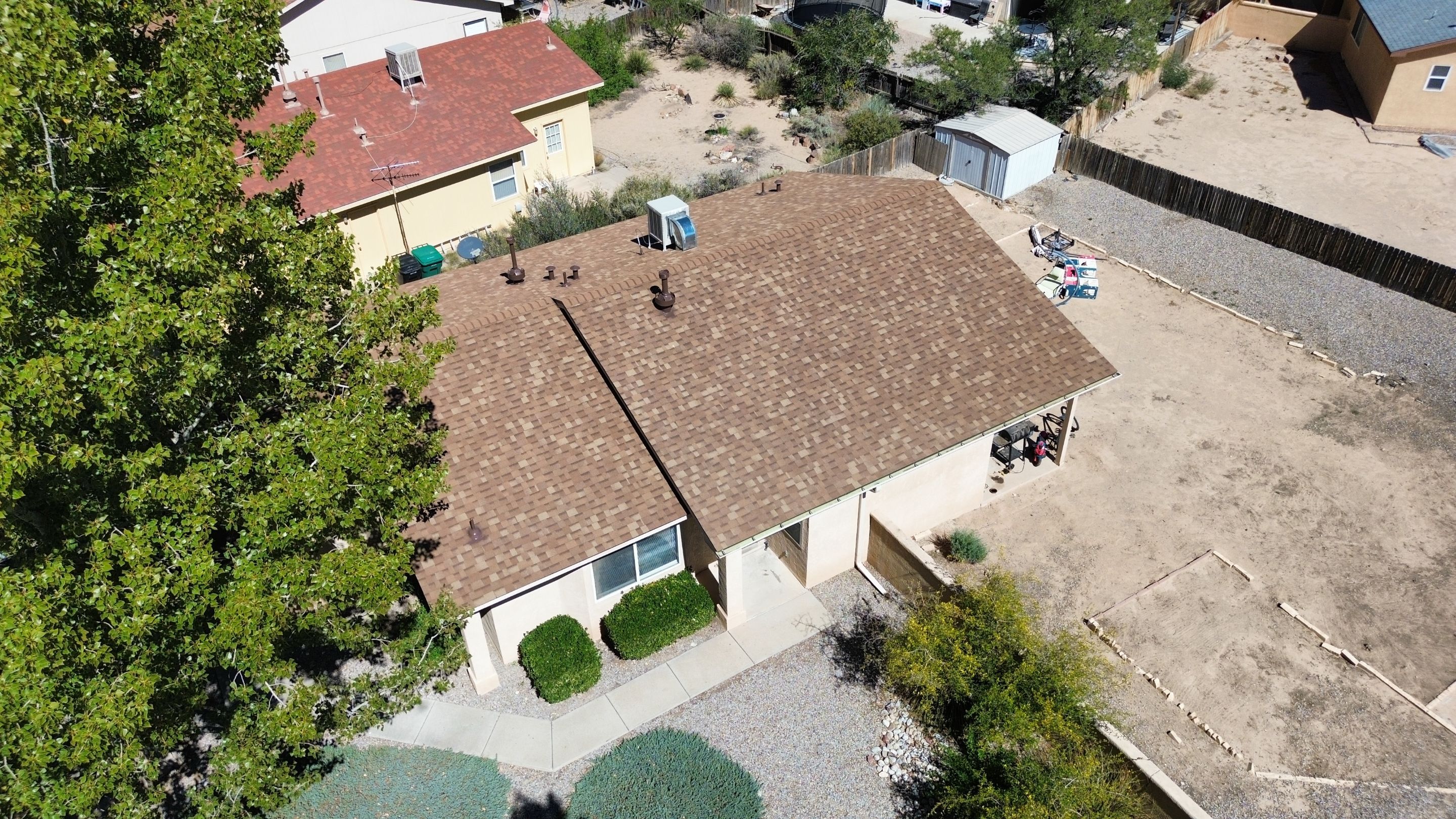 Oakridge Desert tan shingles in Chimayo Meadows by Doyle Roof Masters Inc