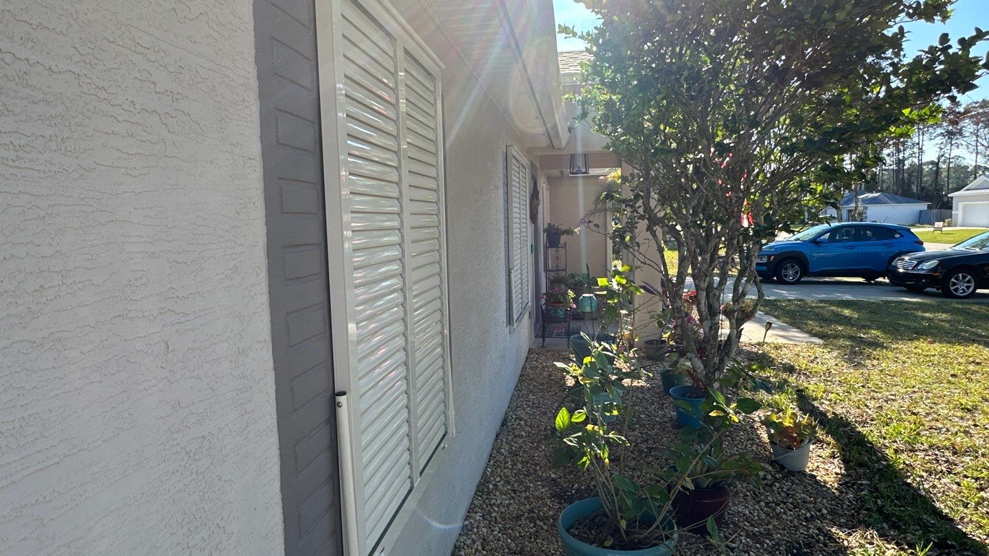 Hurricane Rated Bahama Shutters in Cream by Smart Guard Shutters