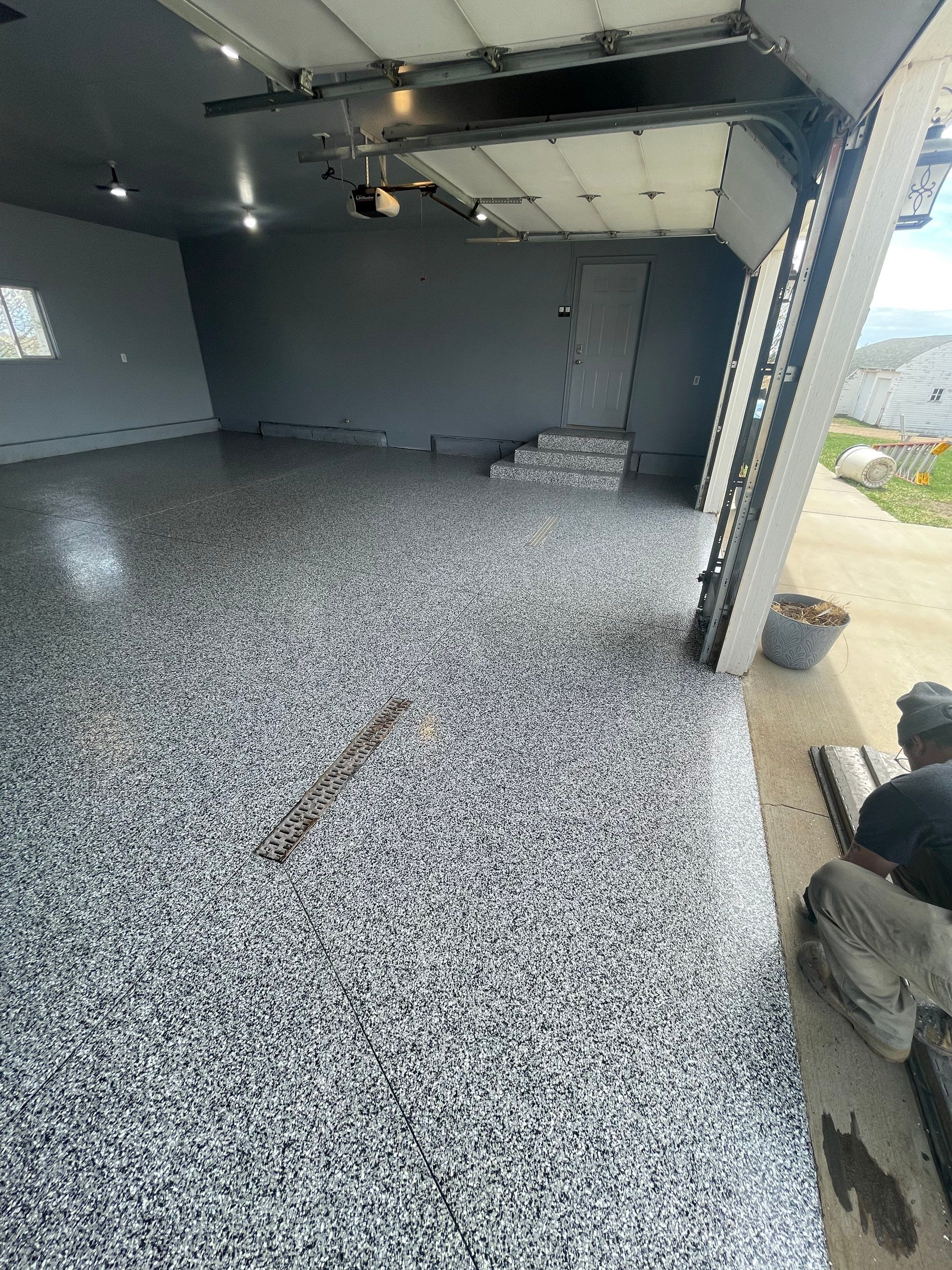 Grey Granite-Style Garage Floor Coating and Stairs in Hartford by Select Painting, Coatings & Garage Cabinets