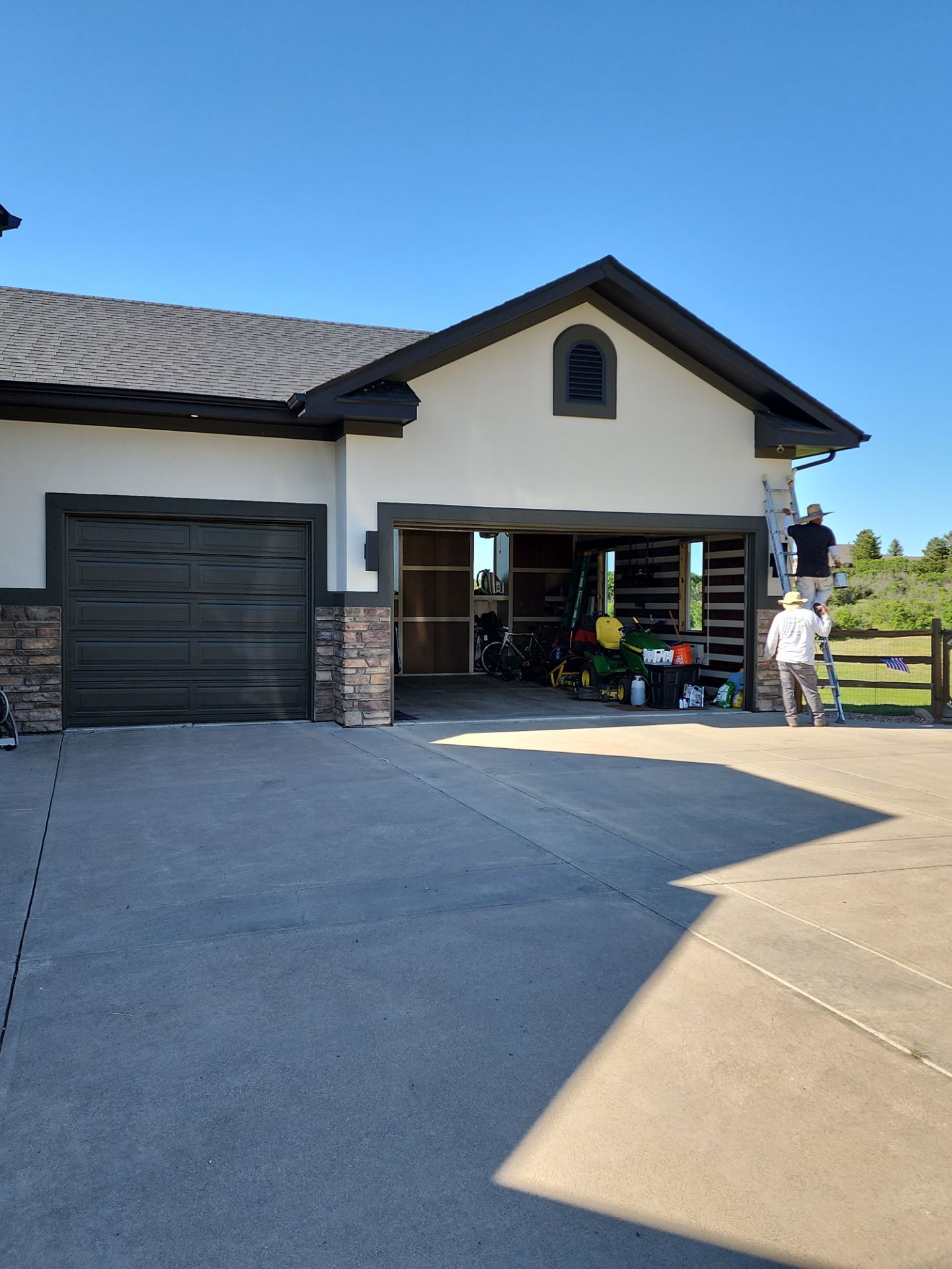 Castle Rock Elegance: White Stucco Exterior with Bold Tricorn Black by J&M Painting LLC