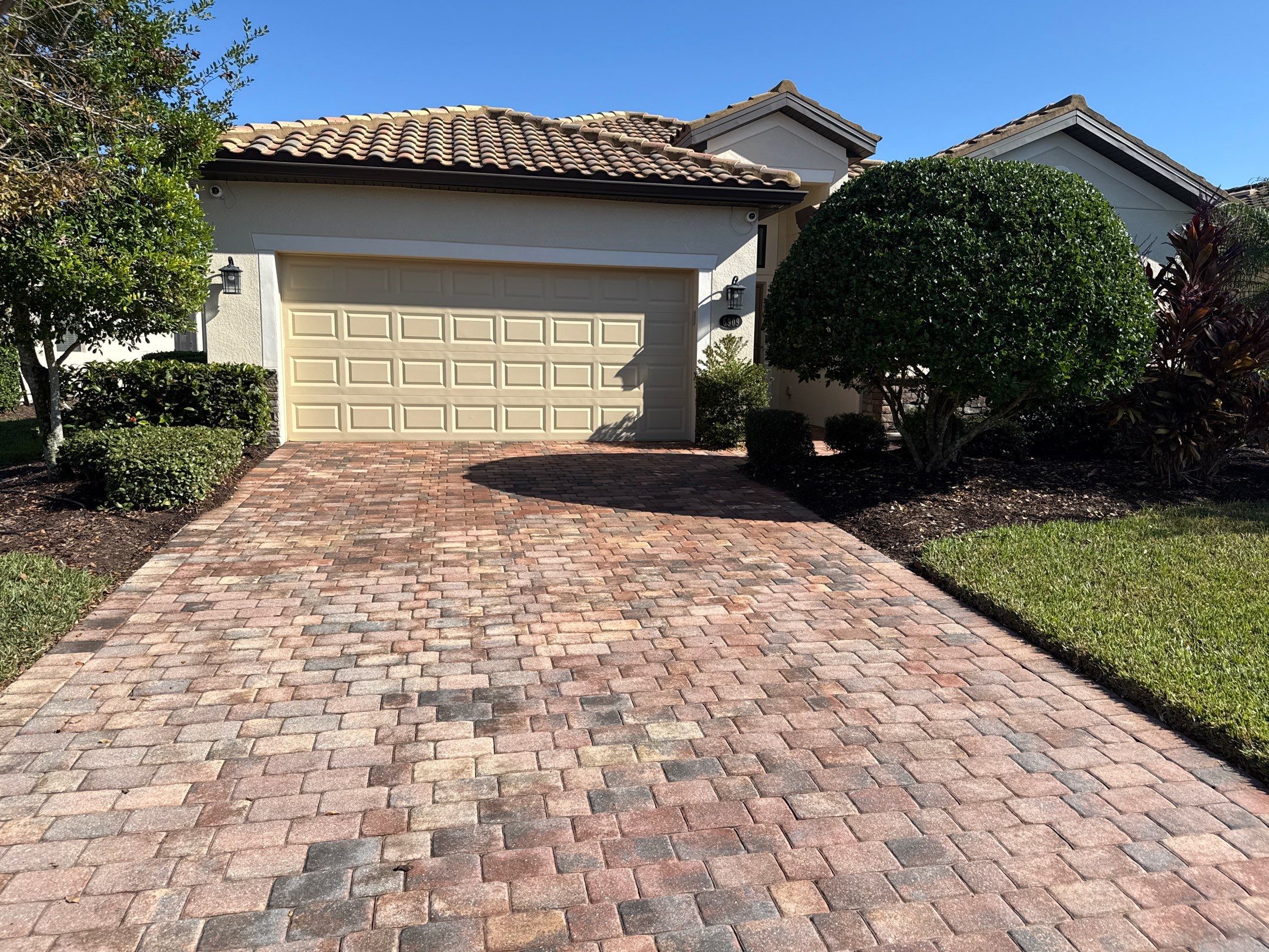Barrel Tile Roof Cleaning & Paver Driveway Cleaning in River Strand at Heritage Harbour | Bradenton, FL by Sunshine AquaWash