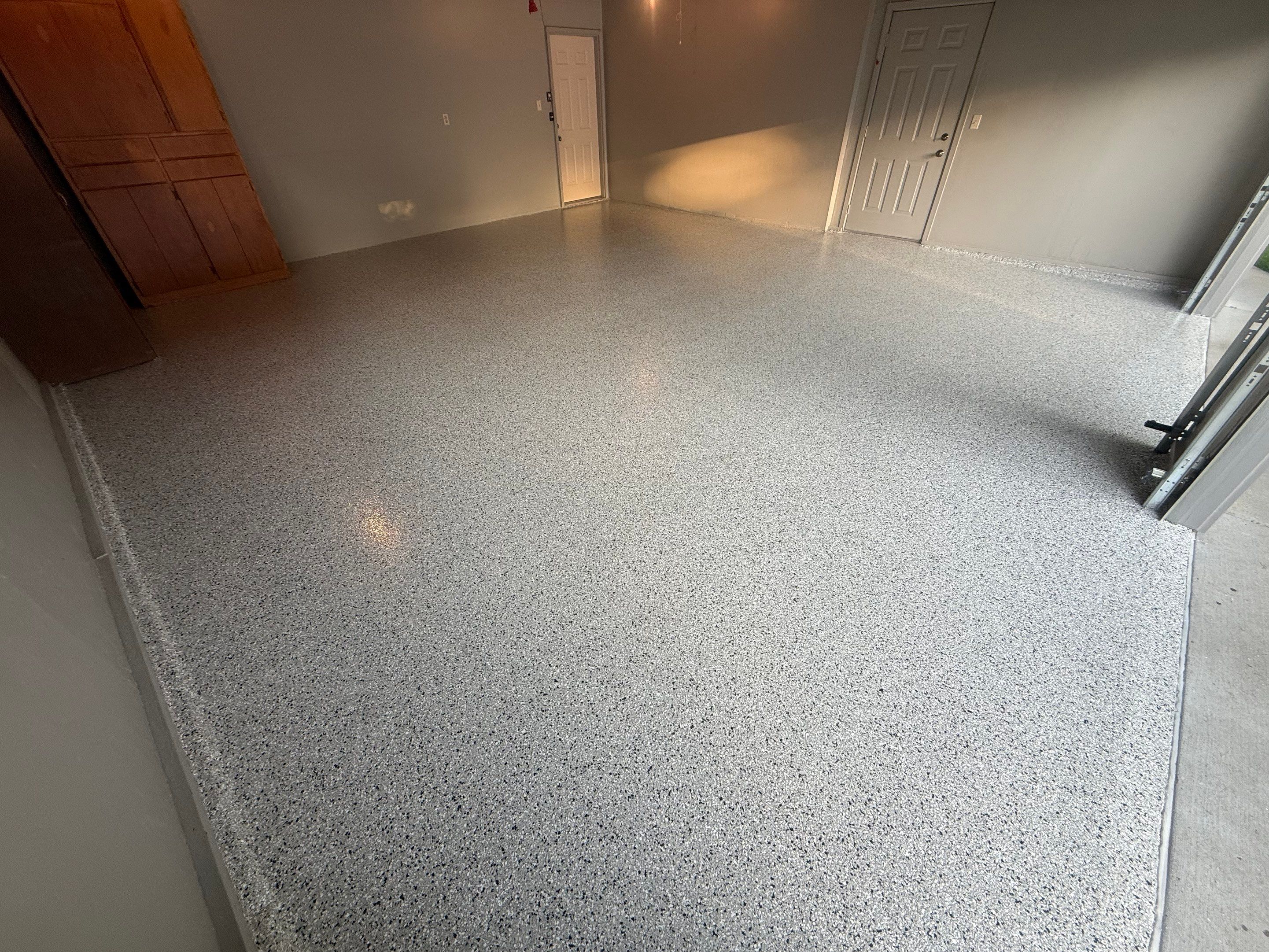 Cabin Fever Concrete Coating for Sioux Falls Garage by Select Painting, Coatings & Garage Cabinets