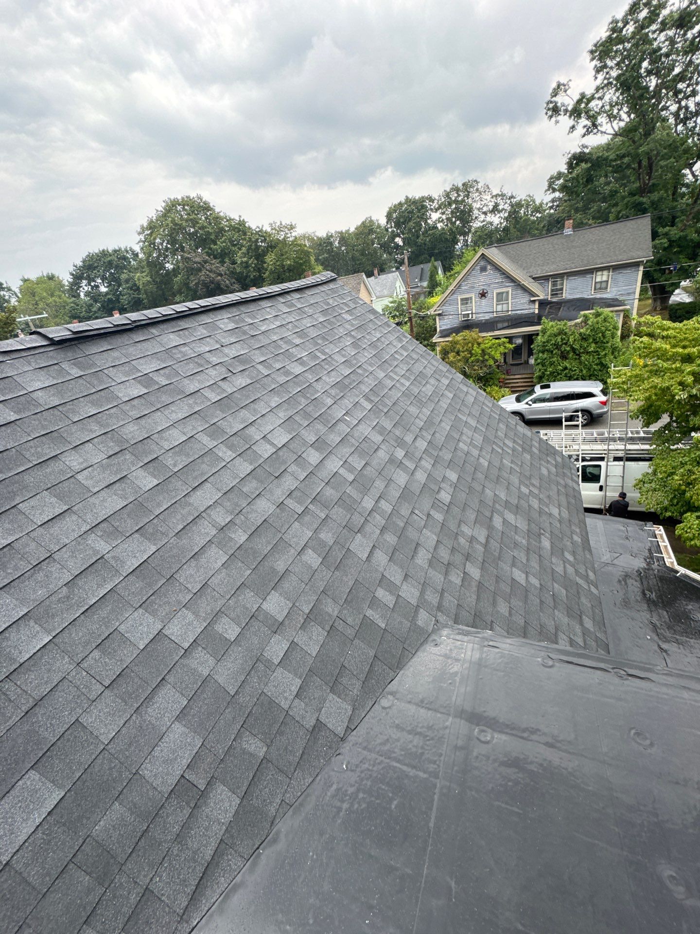 Full Roof Replacement + Custom Gutter Install | Onyx Black Finish by Mighty Dog Roofing of Greater Middlesex County