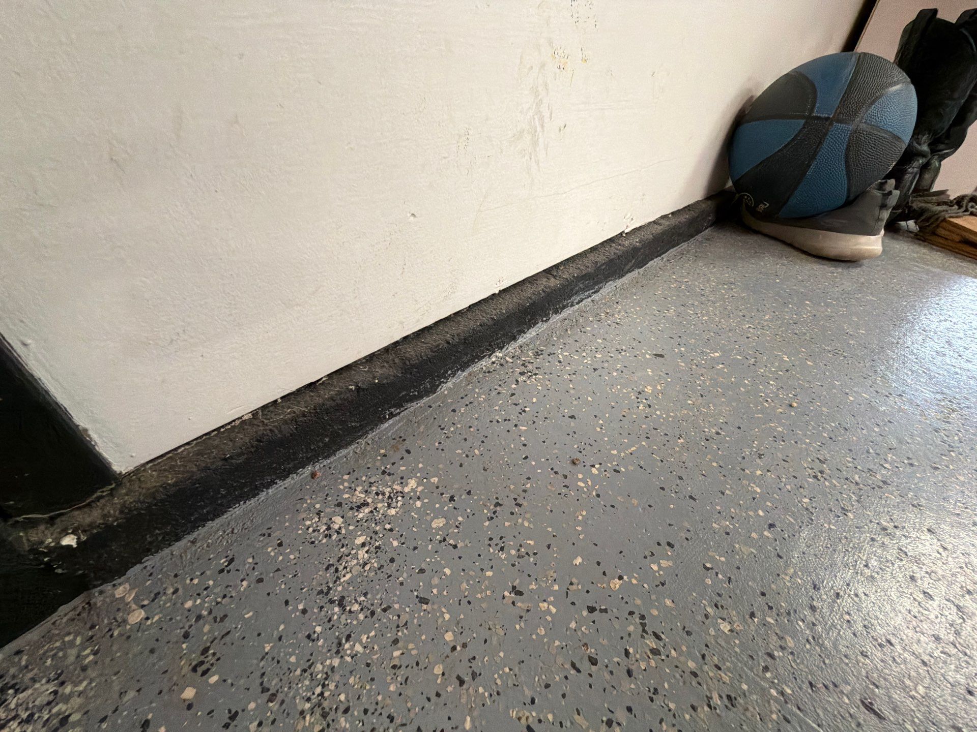 Custom Grey Flake Epoxy Garage Floor Installation in Remsen by Select Painting, Coatings & Garage Cabinets