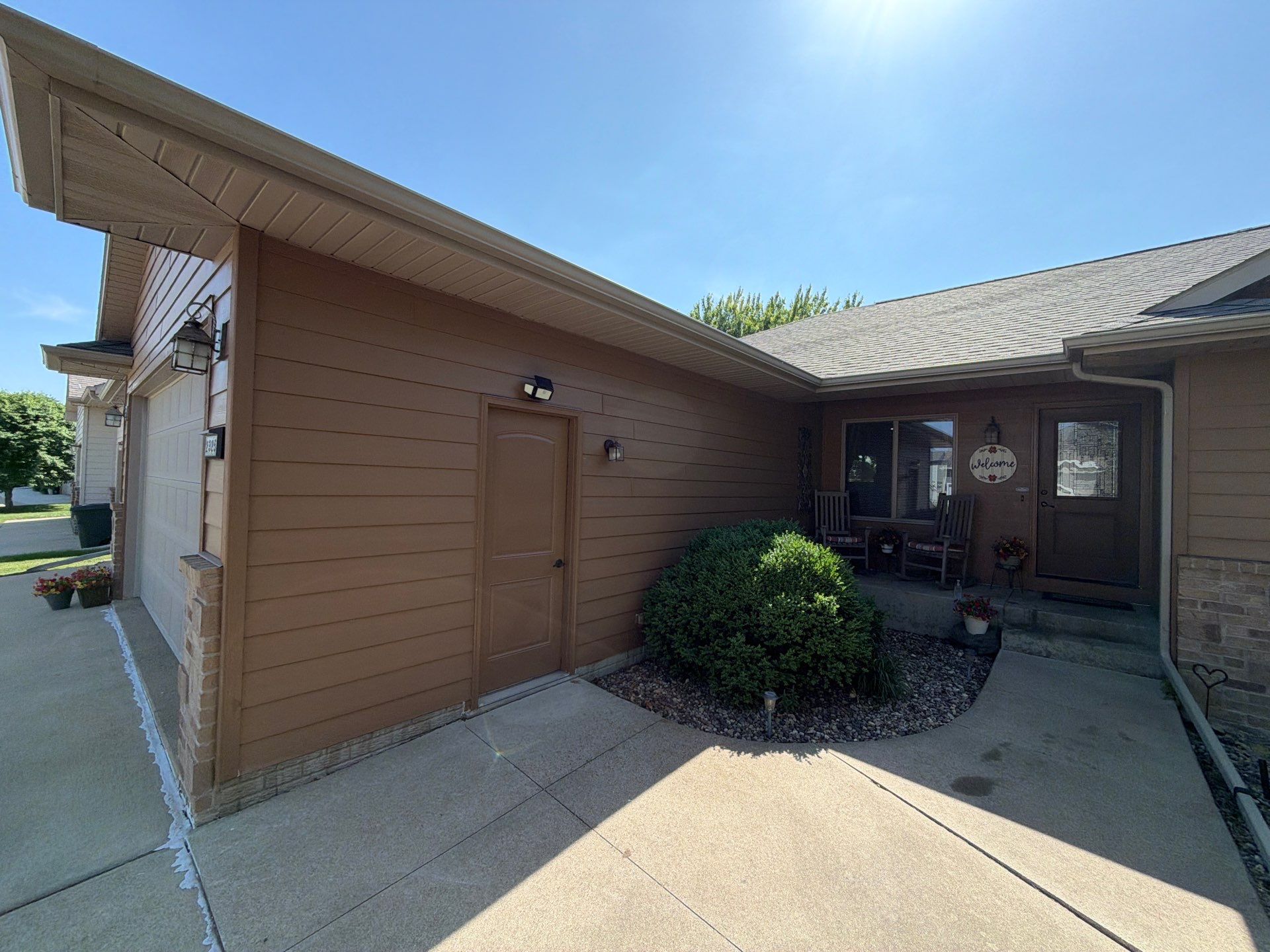 Full Exterior Residential Painting and Siding Refresh in Tea by Select Painting, Coatings & Garage Cabinets