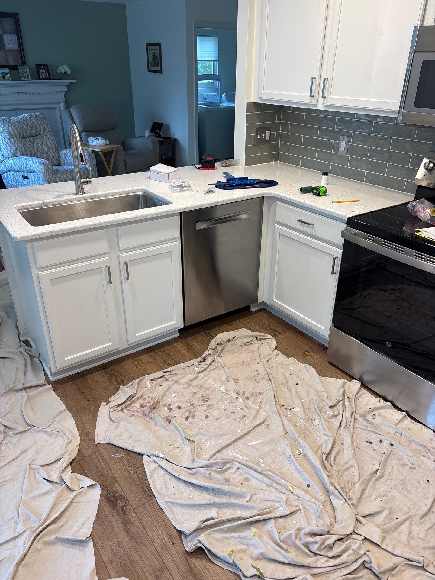 White Shaker Cabinet Installation and Quartz Countertop Replacement in Rochester by Top Shelf Painter