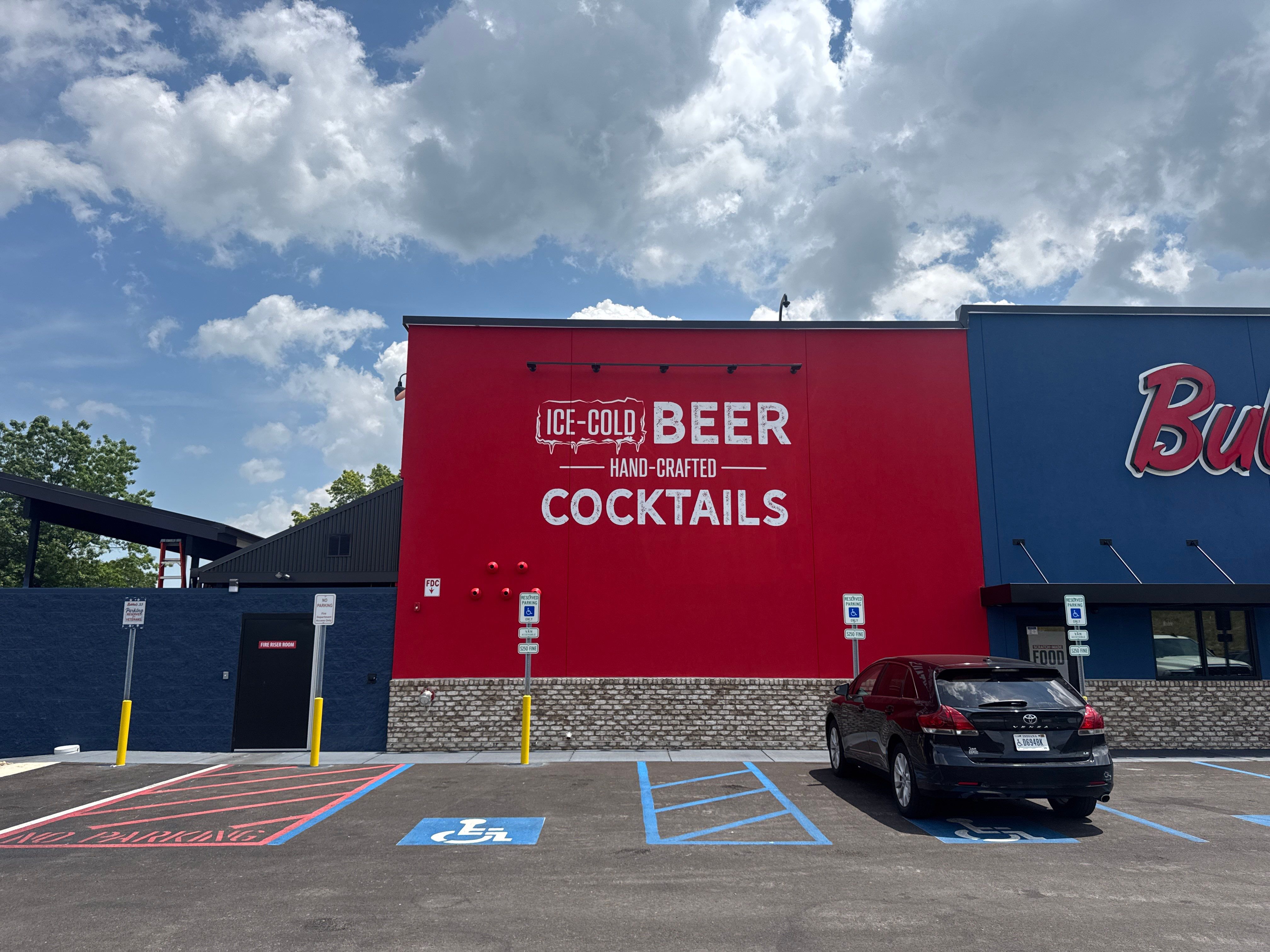 Bubba's 33 Exterior Vinyl Graphic and Painted Signage Installation by Hayes Design co