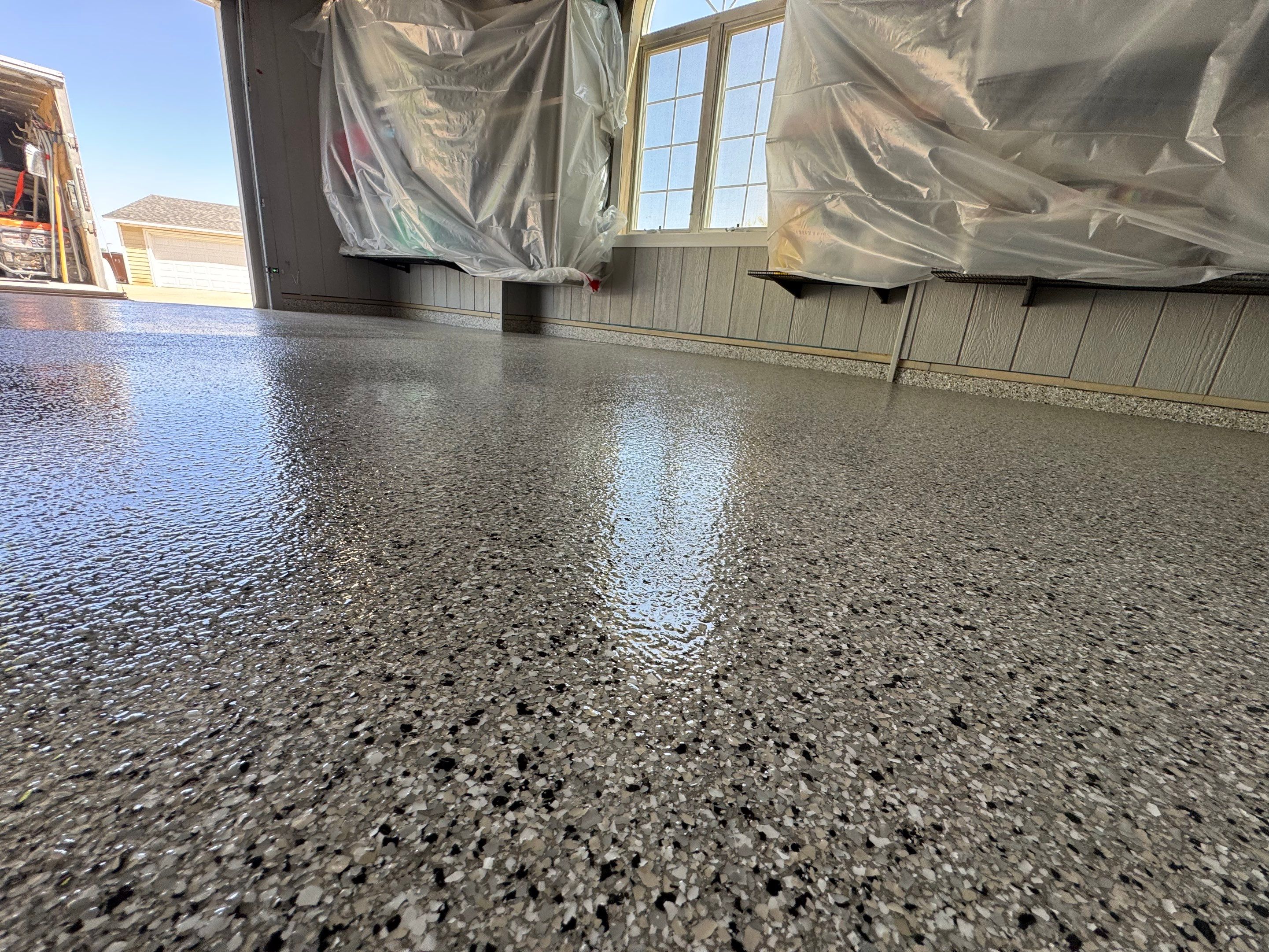 High-Gloss Grey Epoxy Floor Coating for Inwood Garage by Select Painting, Coatings & Garage Cabinets
