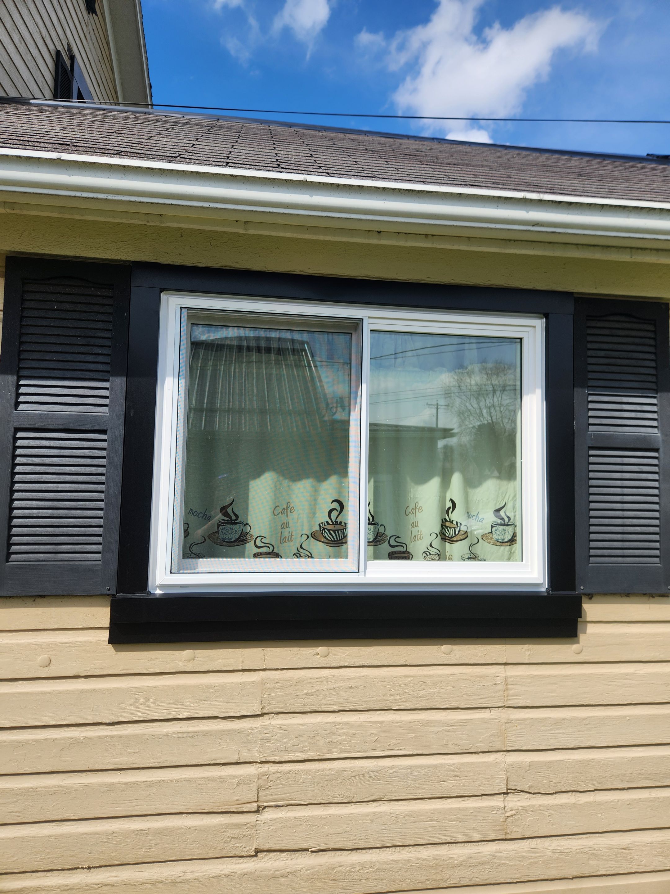 Vinyl Window Replacement and Black Shutter Installation in Dennison by Ohio State Windows