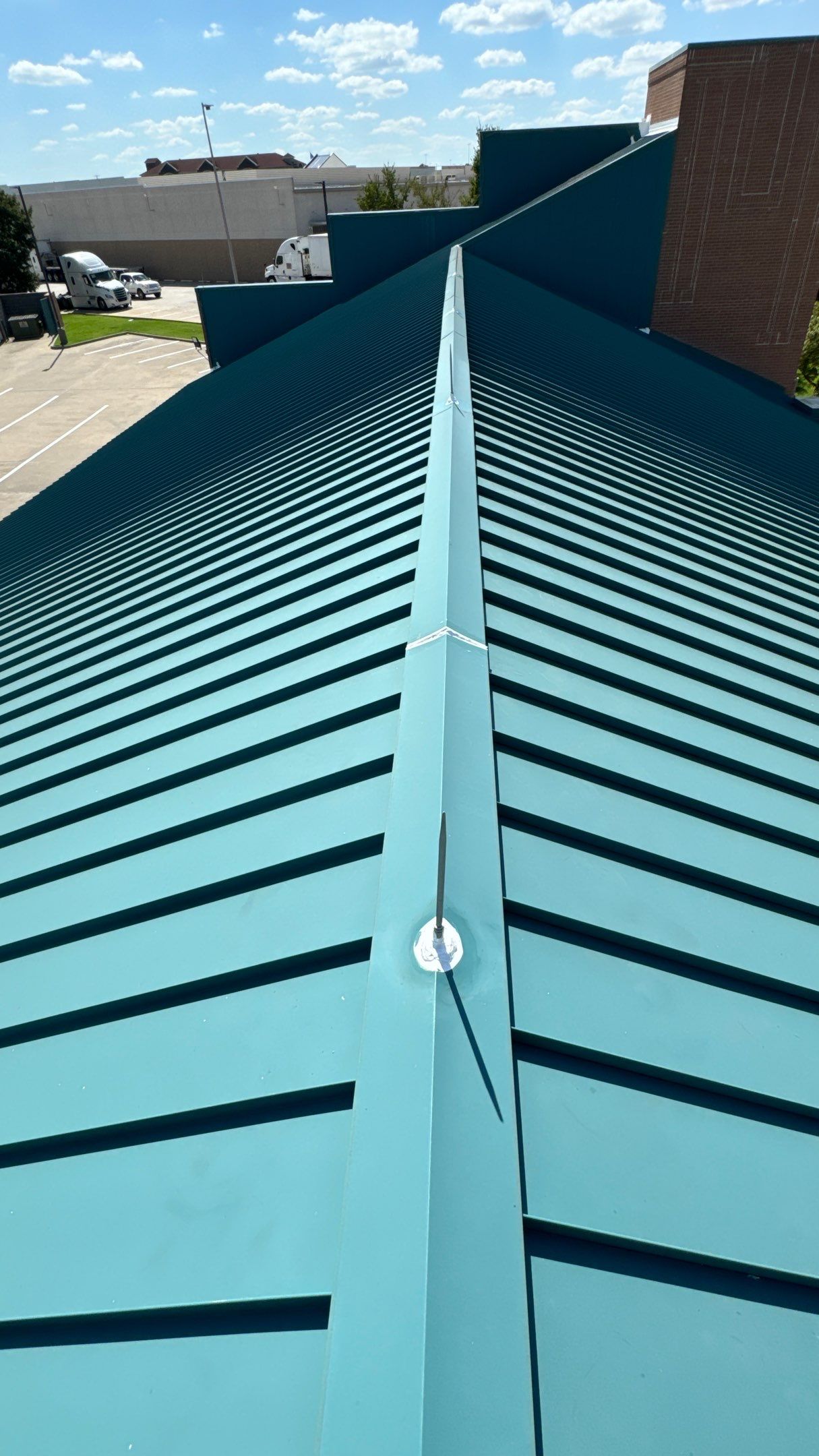 Commercial Roofing Repair using TRP #924 Eterna-Sil Premium Silicone Roof Coating by Harvey Roofing & Construction