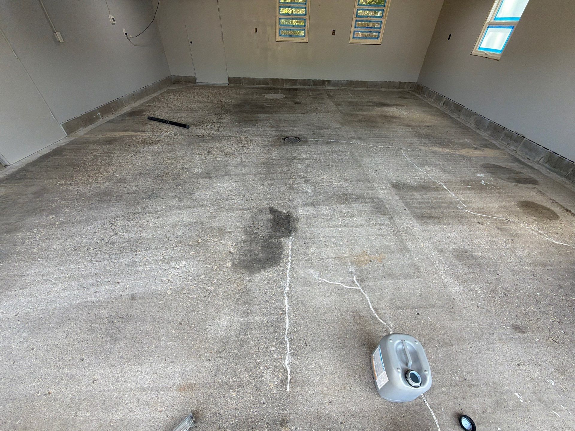 Garage Epoxy Flake Floor Installation and Exterior Siding Repairs in Muskegon by Gordon Painting