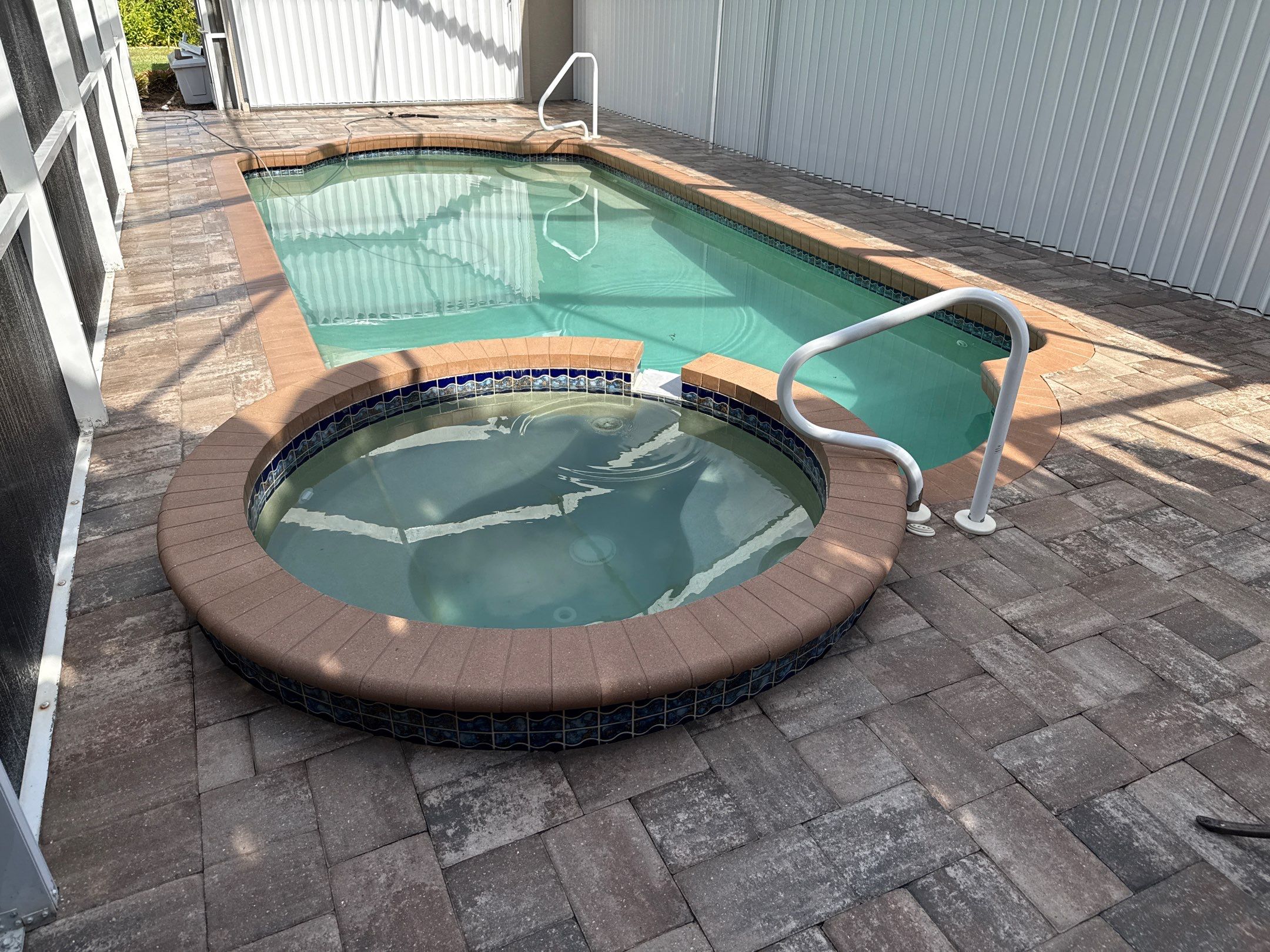 Paver Pool Deck & Screen Enclosure Transformation | University Park, Sarasota FL by Sunshine AquaWash