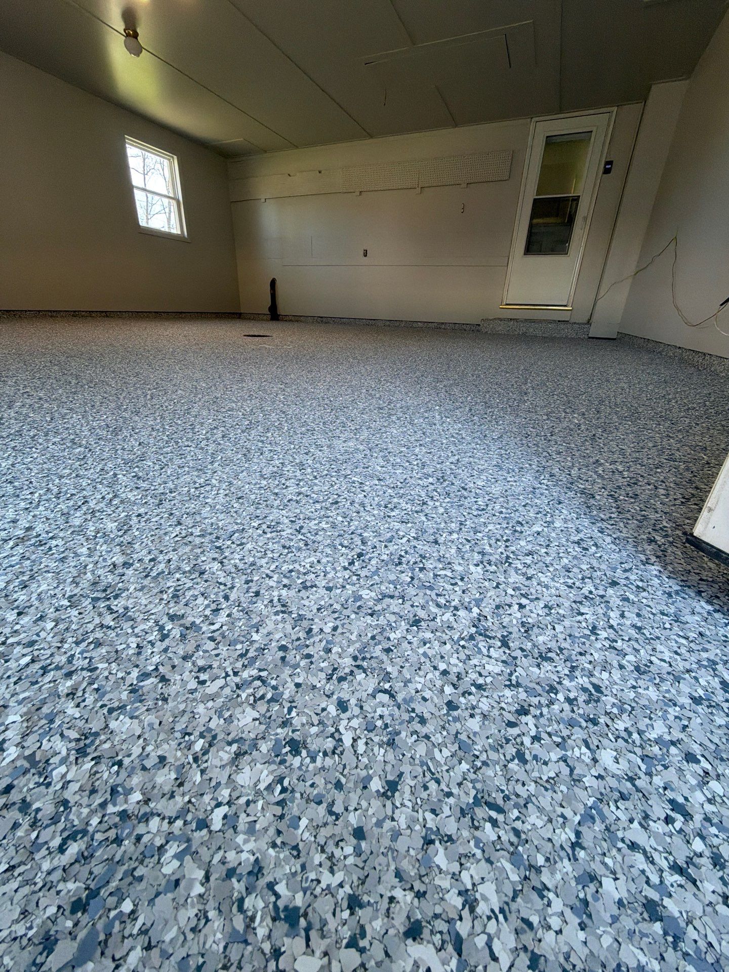 Muskegon Garage Interior Painting and Epoxy Flake Floor Installation by Gordon Painting