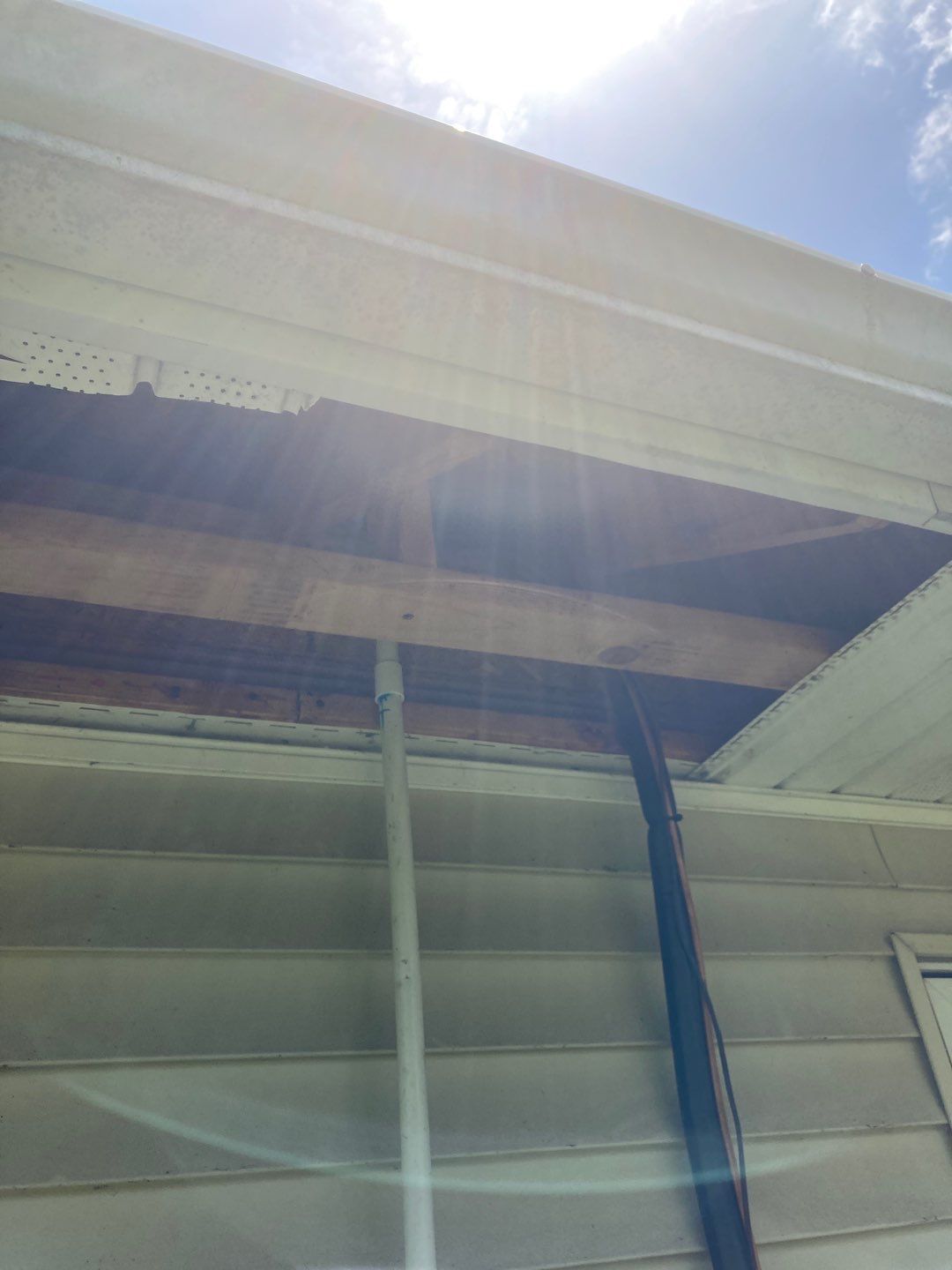 Gutter Installation using 5" Seamless Aluminum Gutters by Absolute Roofing and Construction