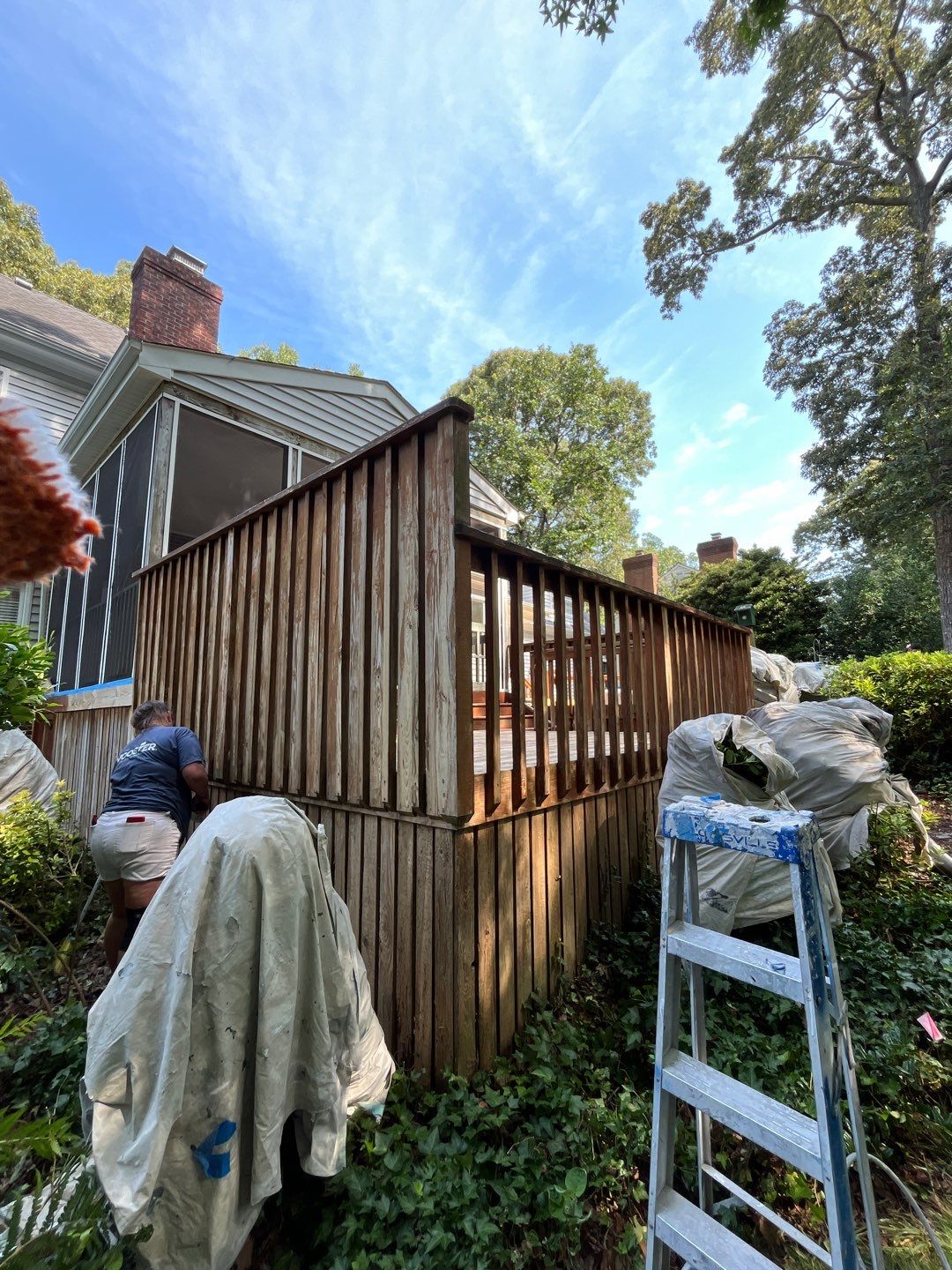 Triple deck re-staining by AKK Painting LLC