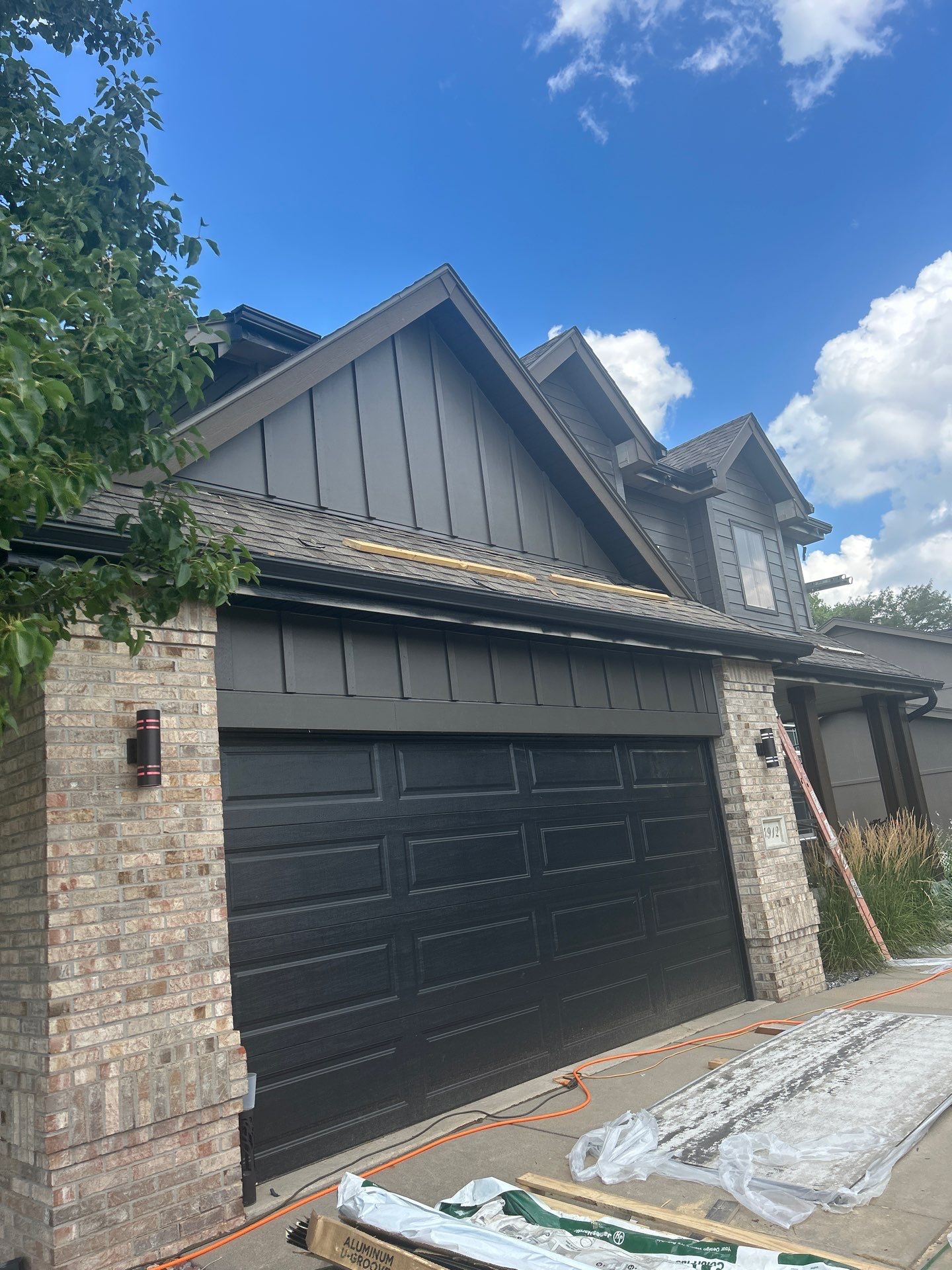 Marvin Window Replacement and Rich Espresso Hardie Siding Installation in Omaha by Carps Complete Exteriors