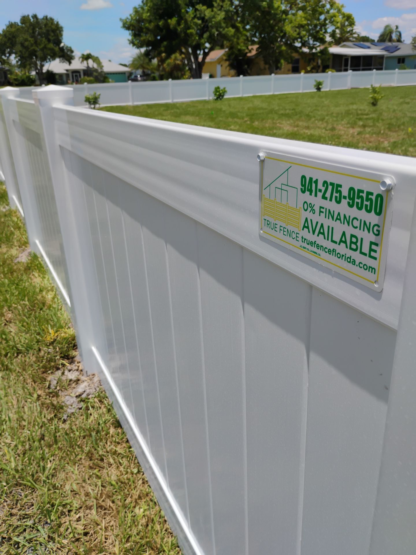 White Vinyl Privacy Fence Installation on Port Charlotte Corner Lot by True Fence LLC