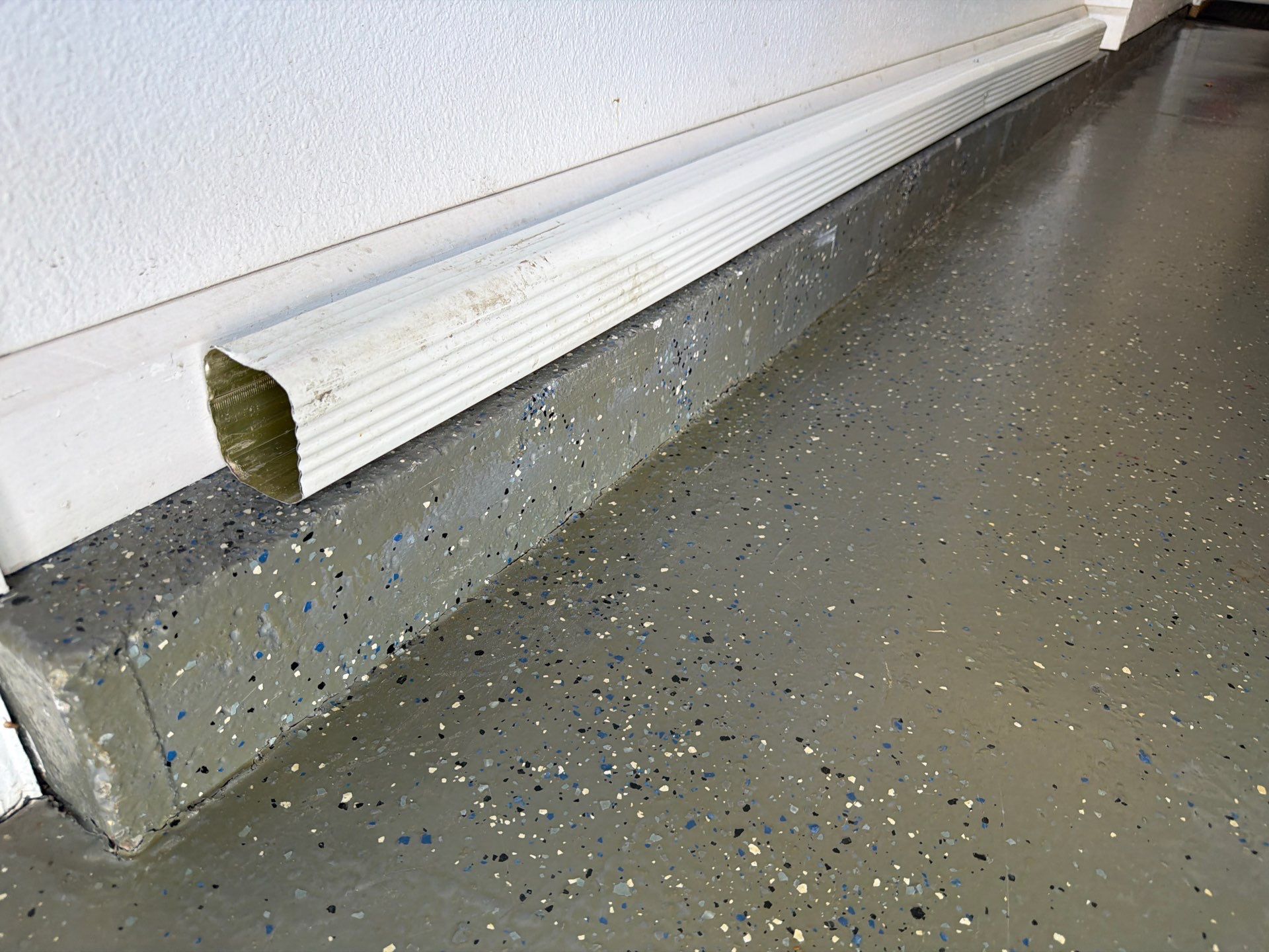Multi-Car Garage Concrete Coating with Coyote Flake Finish in Sioux Falls by Select Painting, Coatings & Garage Cabinets