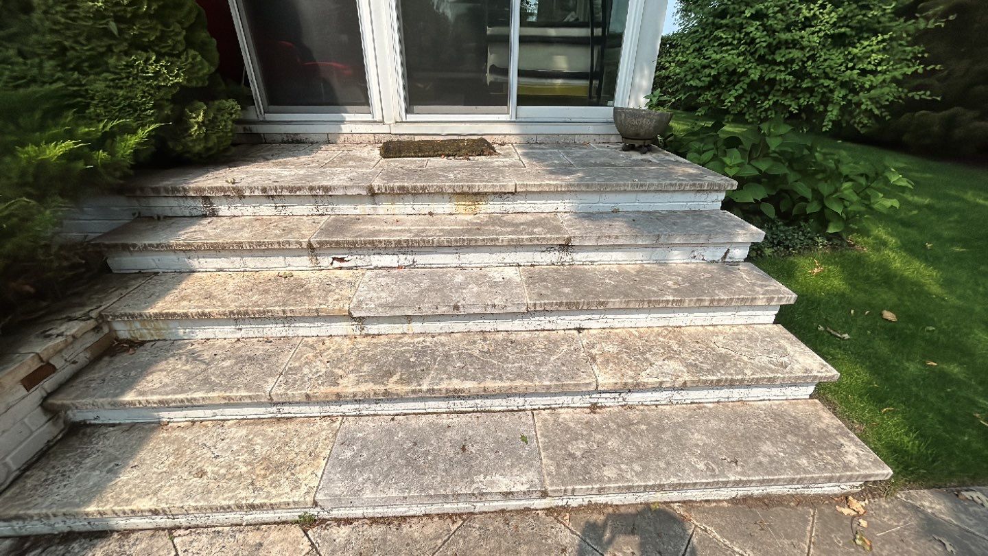 marble patio cleaning and sanding using Polysweep polymeric sand by Northern Power Washing LLC.