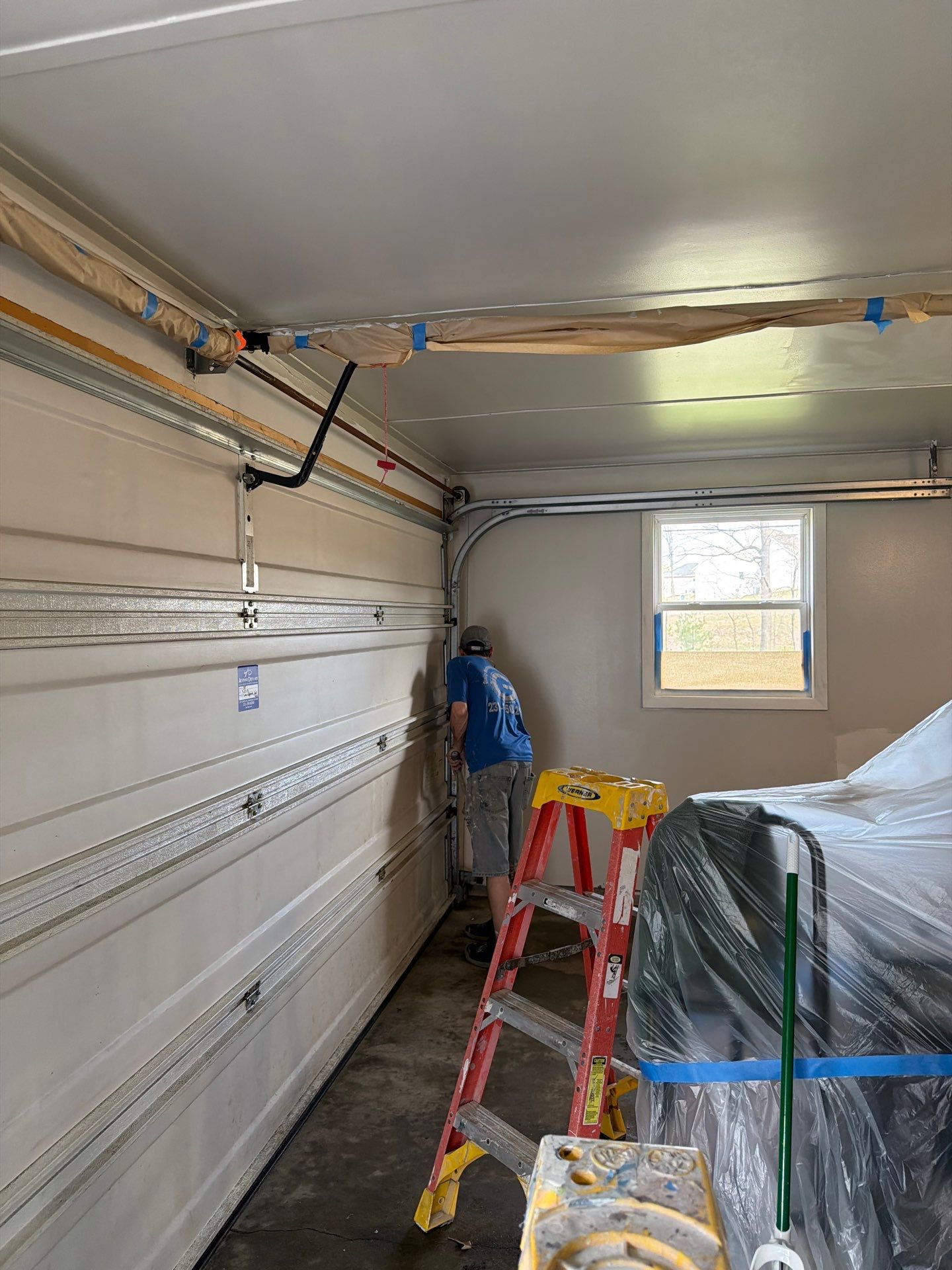 Muskegon Garage Interior Painting and Epoxy Flake Floor Installation by Gordon Painting